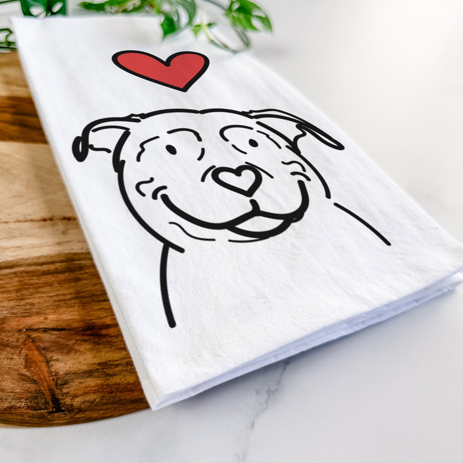 Minimalist line drawing of Lady the American Pitbull Terrier with a red heart on a tea towel