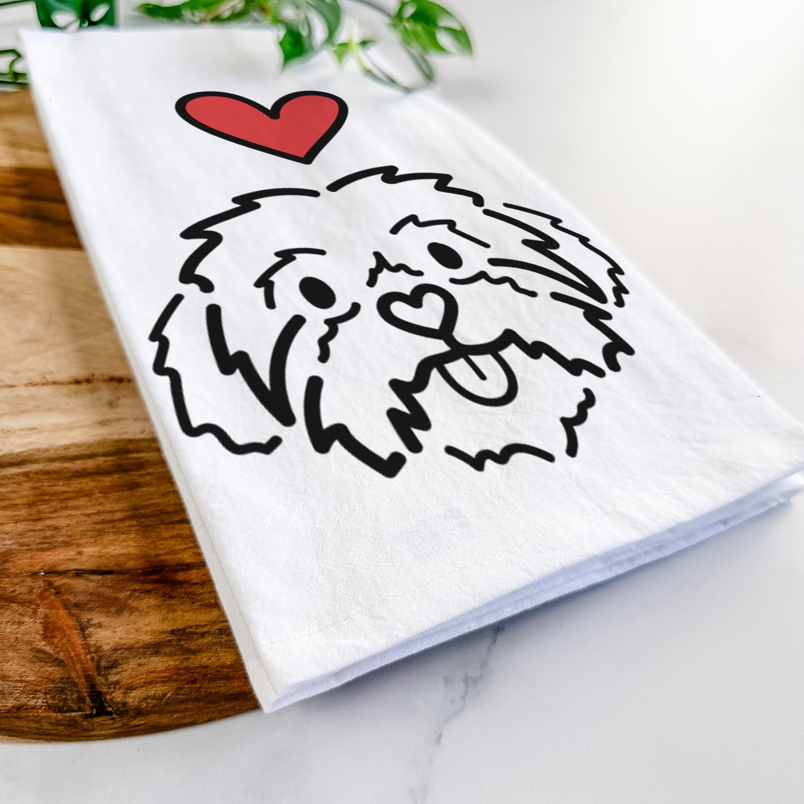 Minimalist line drawing of Leo the Shih Tzu with a red heart on a tea towel