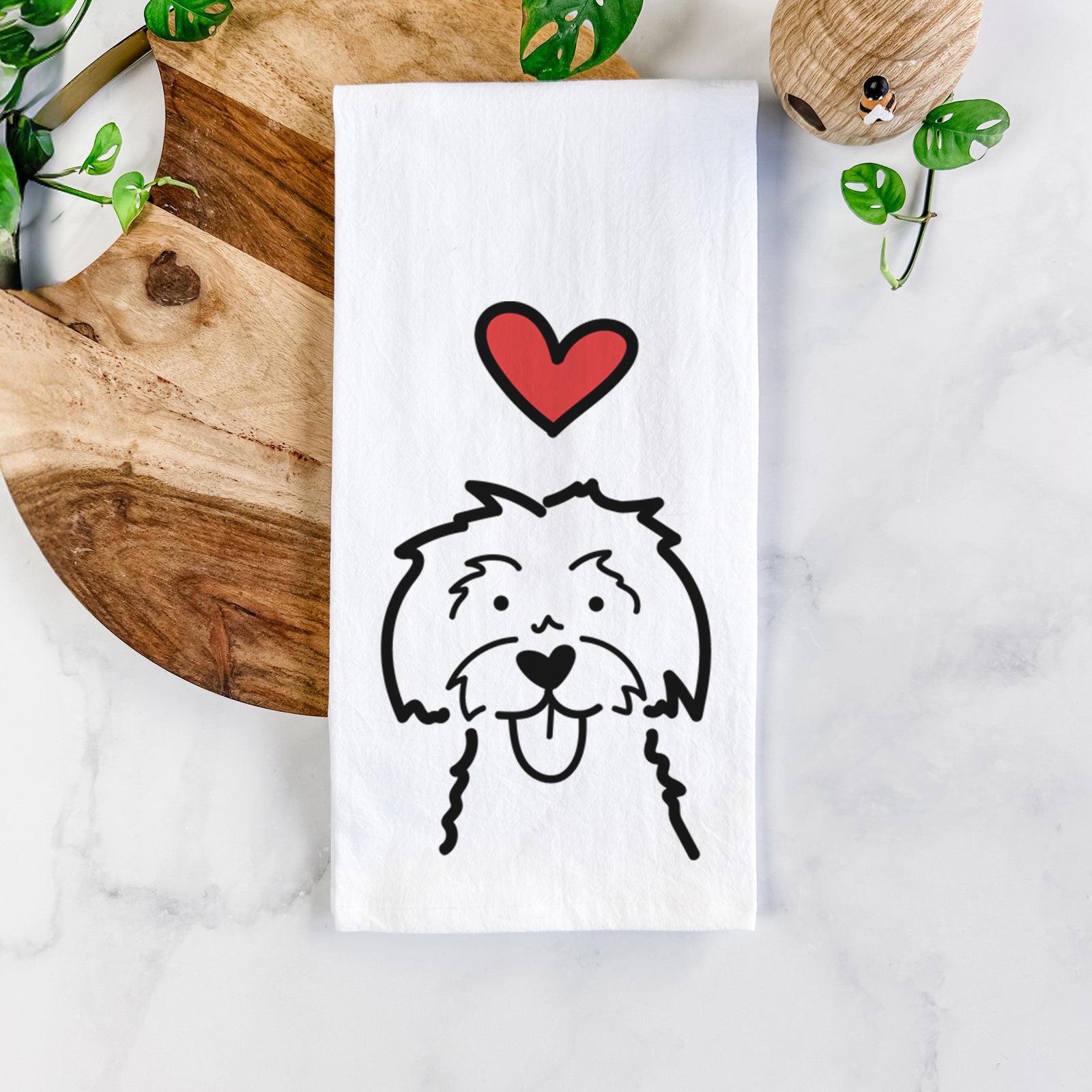 Minimalist line drawing of a Maltese with a red heart on a tea towel
