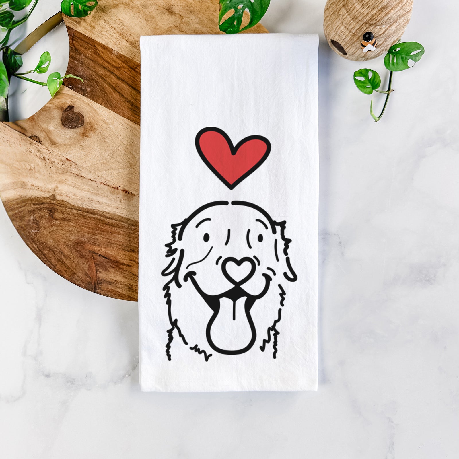 Minimalist line drawing of Maple the Golden Retriever with a red heart on a tea towel