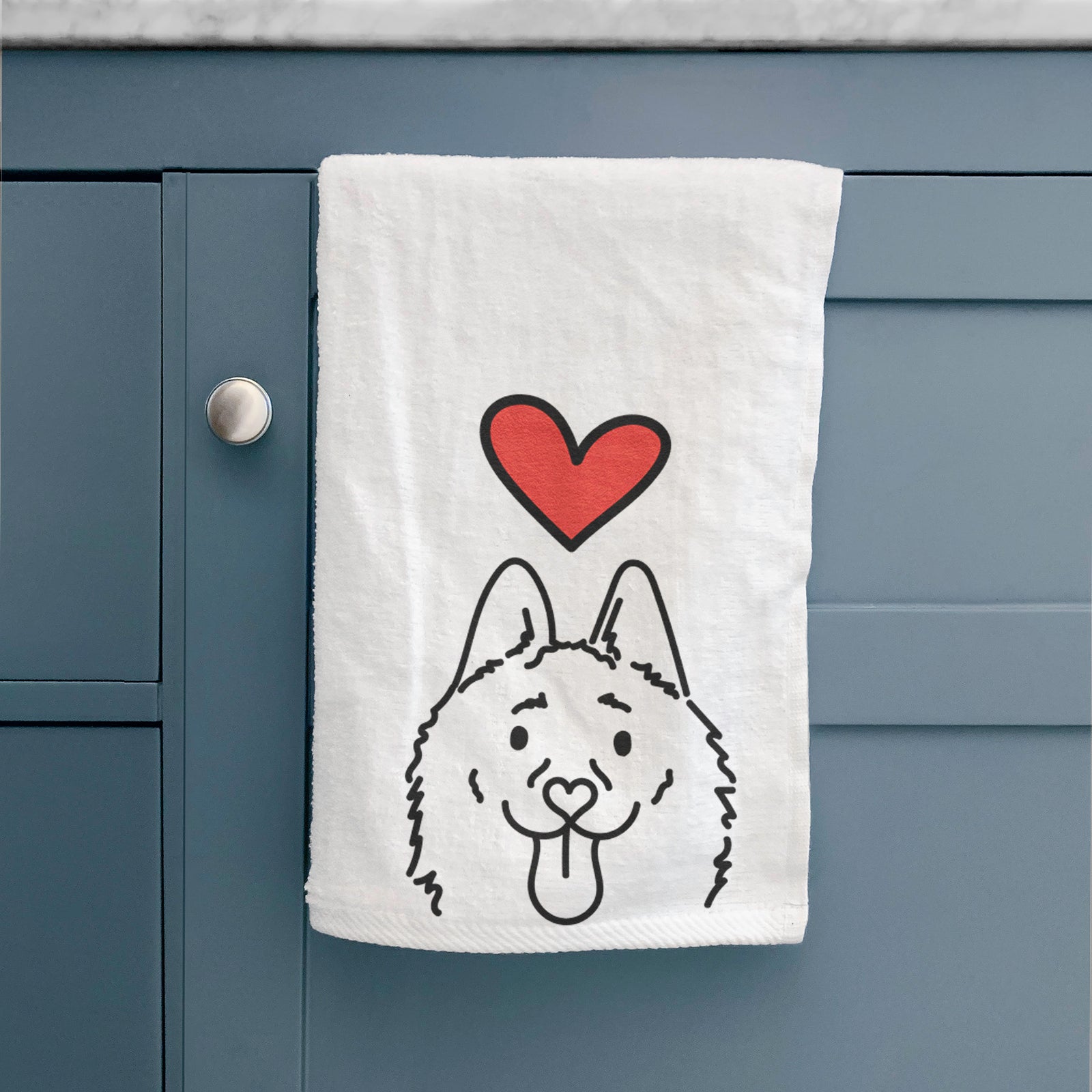 Minimalist line drawing of Meeko the Schipperke with a red heart on a decorative hand towel