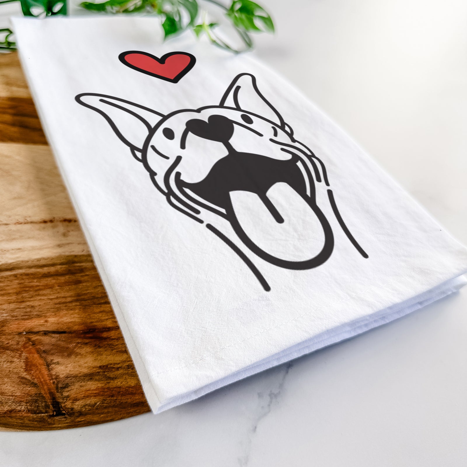 Minimalist line drawing of Merlin the Basenji with a red heart on a tea towel
