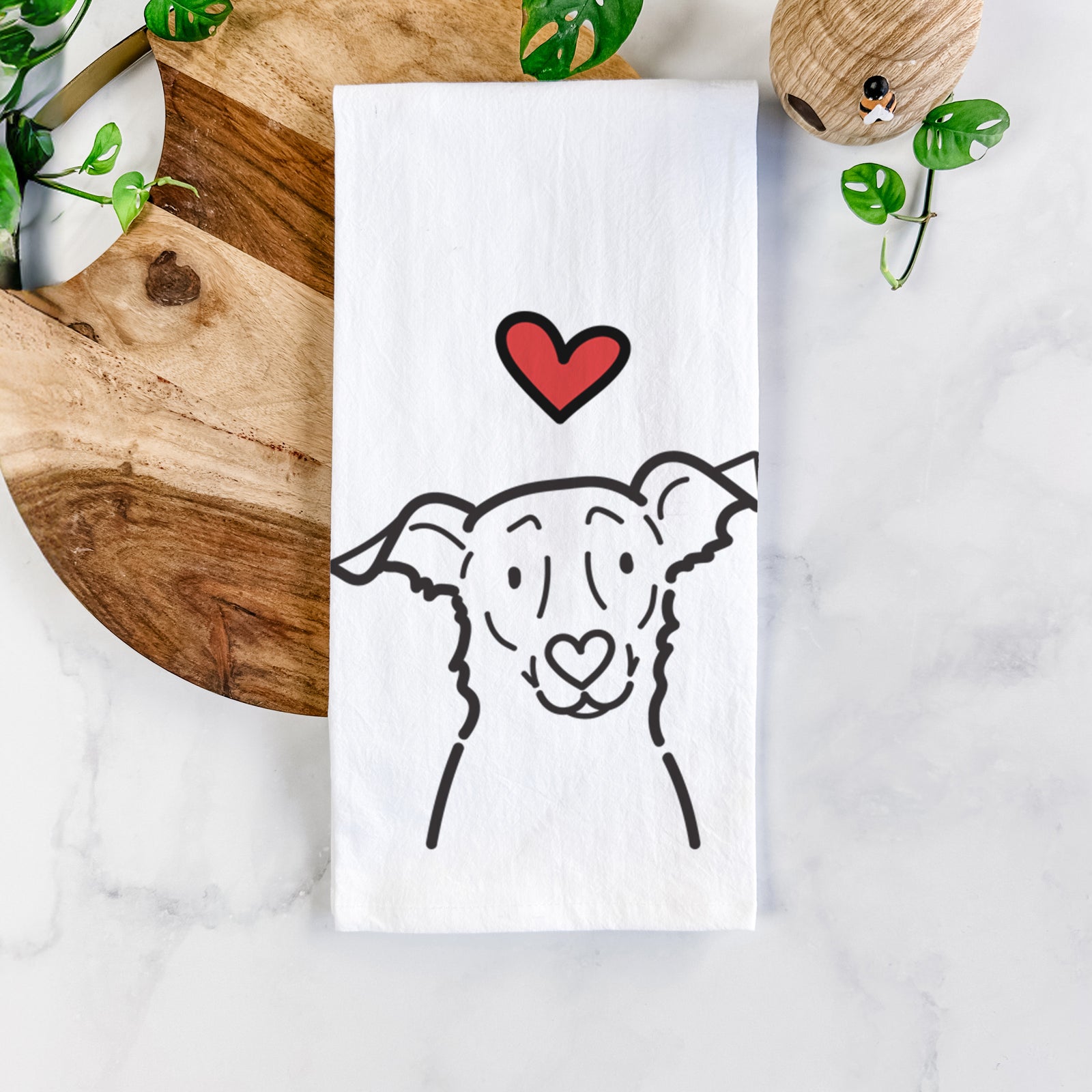 Minimalist line drawing of Millie the Border Collie Mix with a red heart on a tea towel