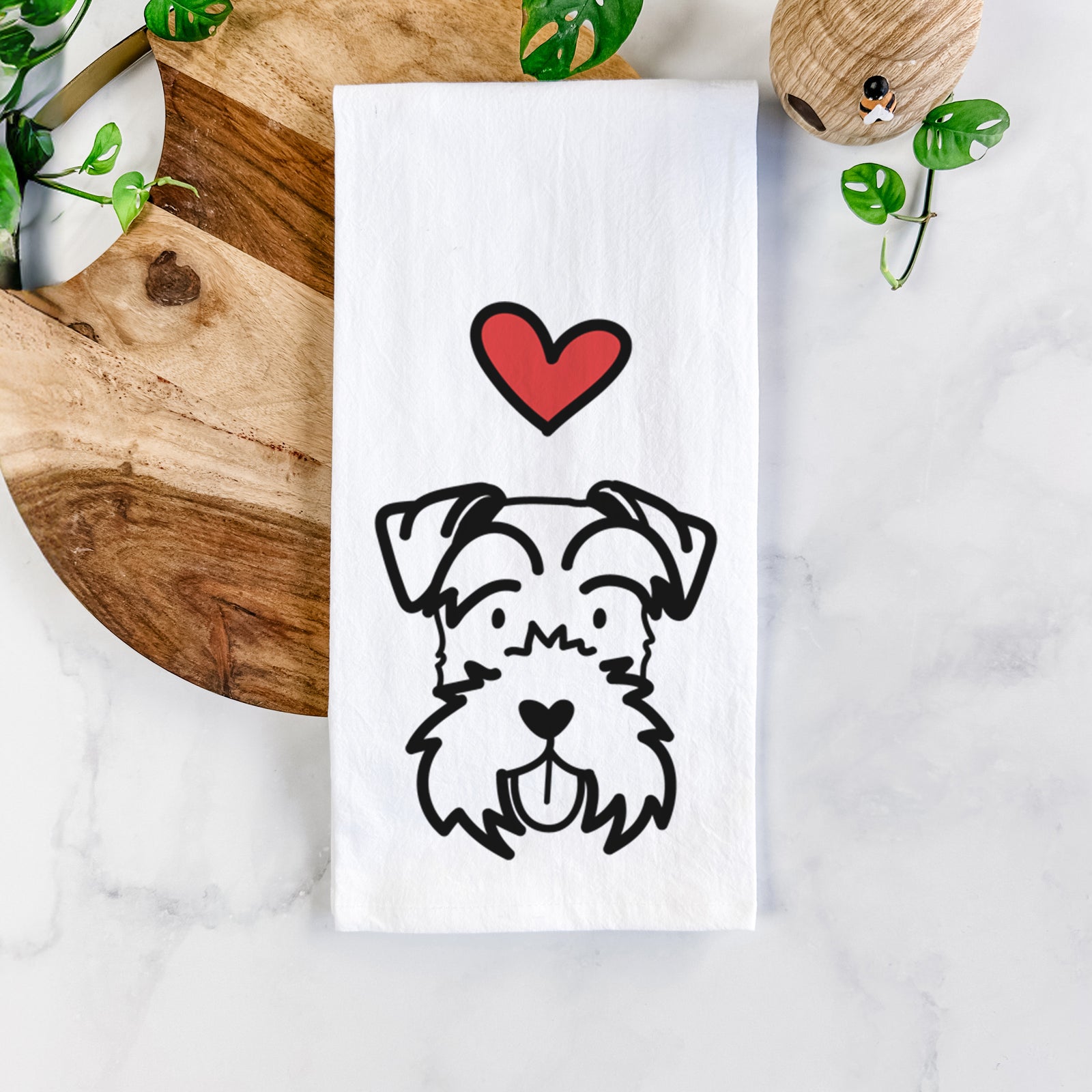Minimalist line drawing of a Miniature Schnauzer with a red heart on a tea towel