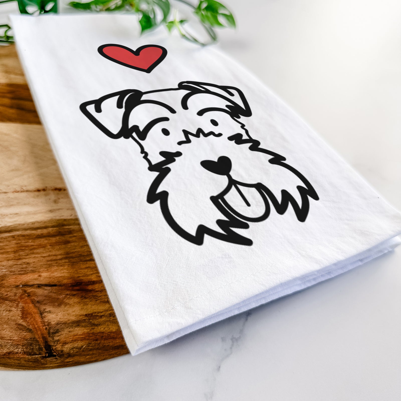 Minimalist line drawing of a Miniature Schnauzer with a red heart on a tea towel