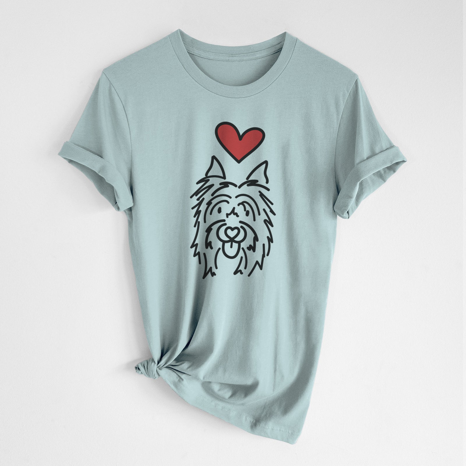 Minimalist line drawing of Monty the Silky Terrier with a red heart on a Dusty Blue Unisex crewneck, worn by a woman