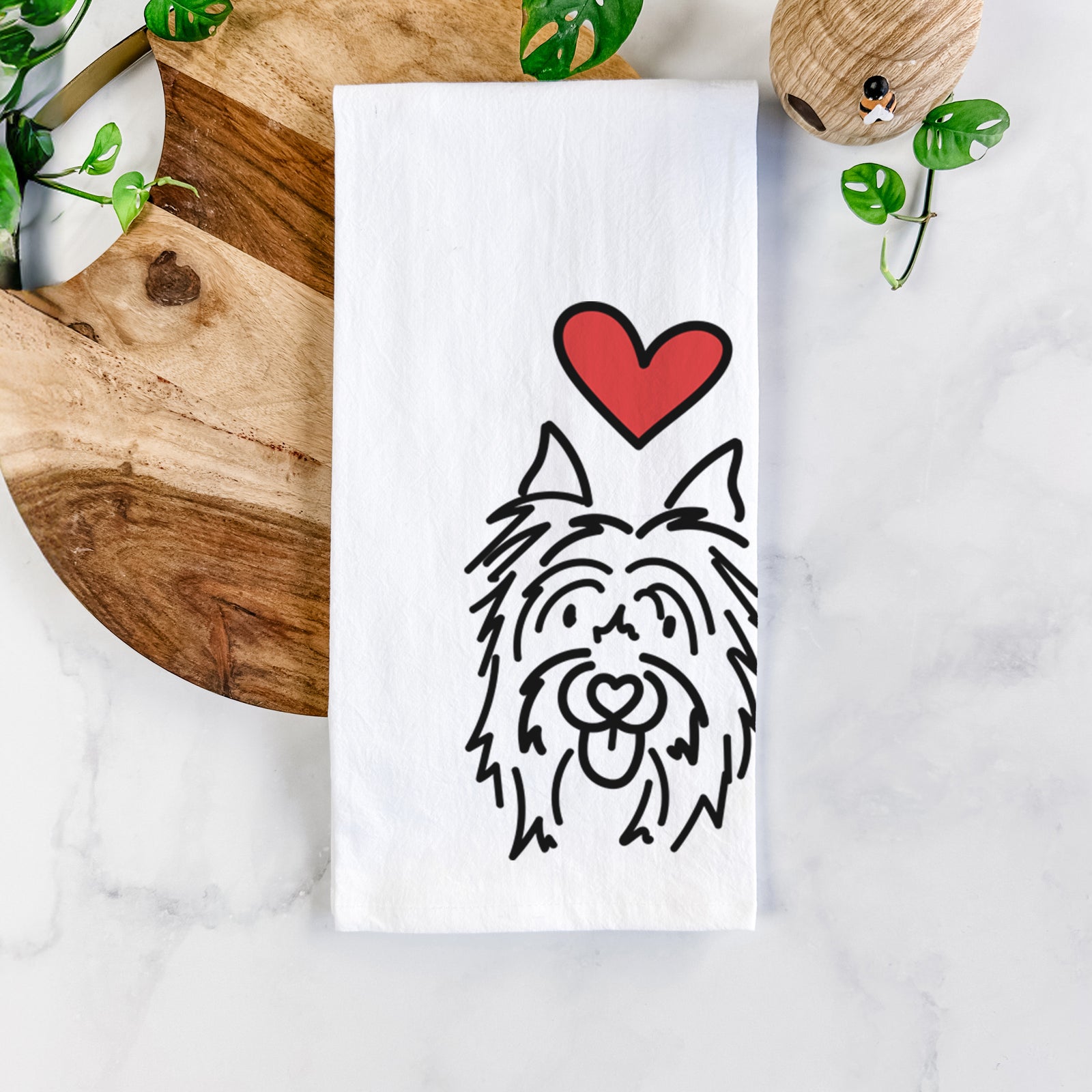 Minimalist line drawing of Monty the Silky Terrier with a red heart on a tea towel