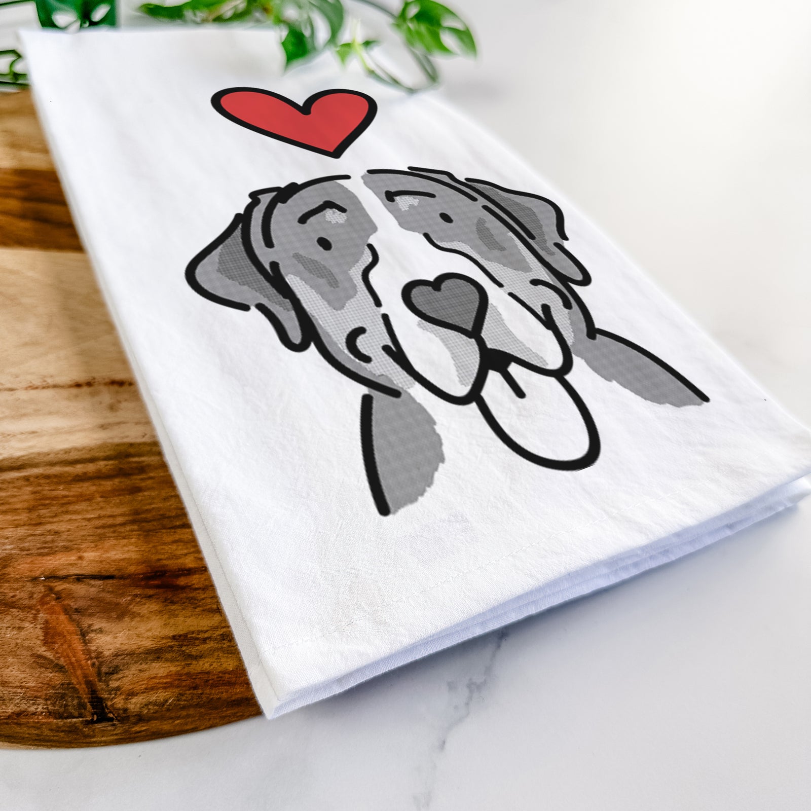 Minimalist line drawing of Moose the Greater Swiss Mountain Dog with a red heart on a tea towel