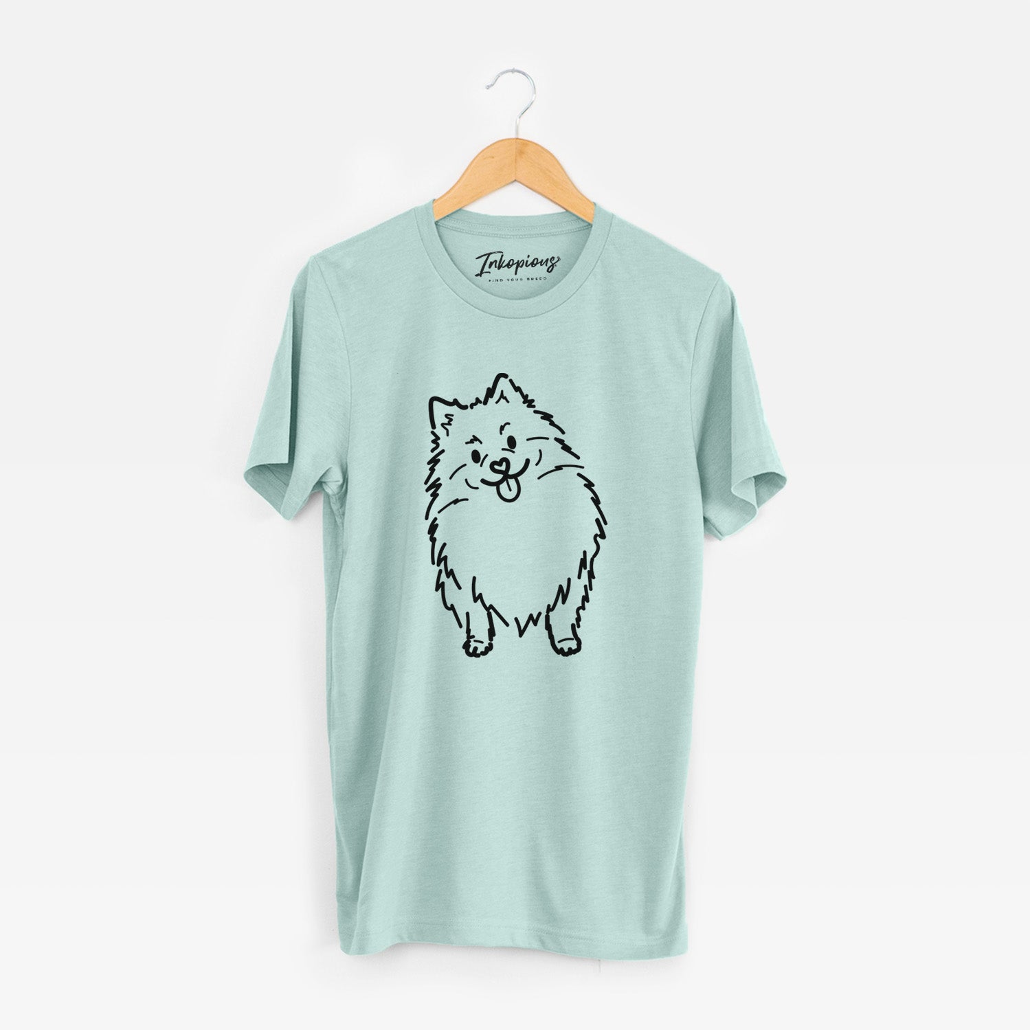 Minimalist line drawing of Fern the Pomeranian on a Heather Sage Unisex crewneck