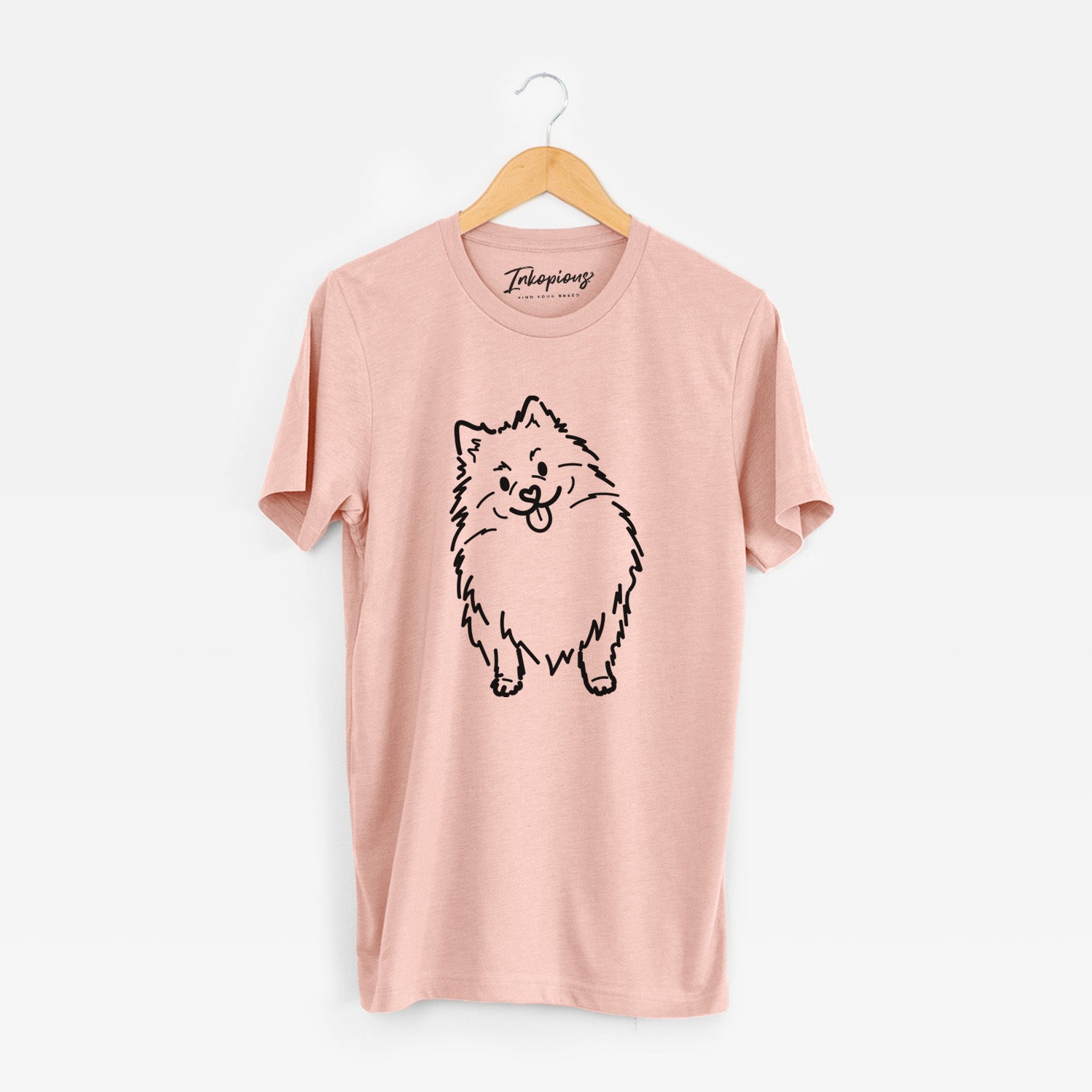 Minimalist line drawing of Fern the Pomeranian on a Peach Unisex crewneck