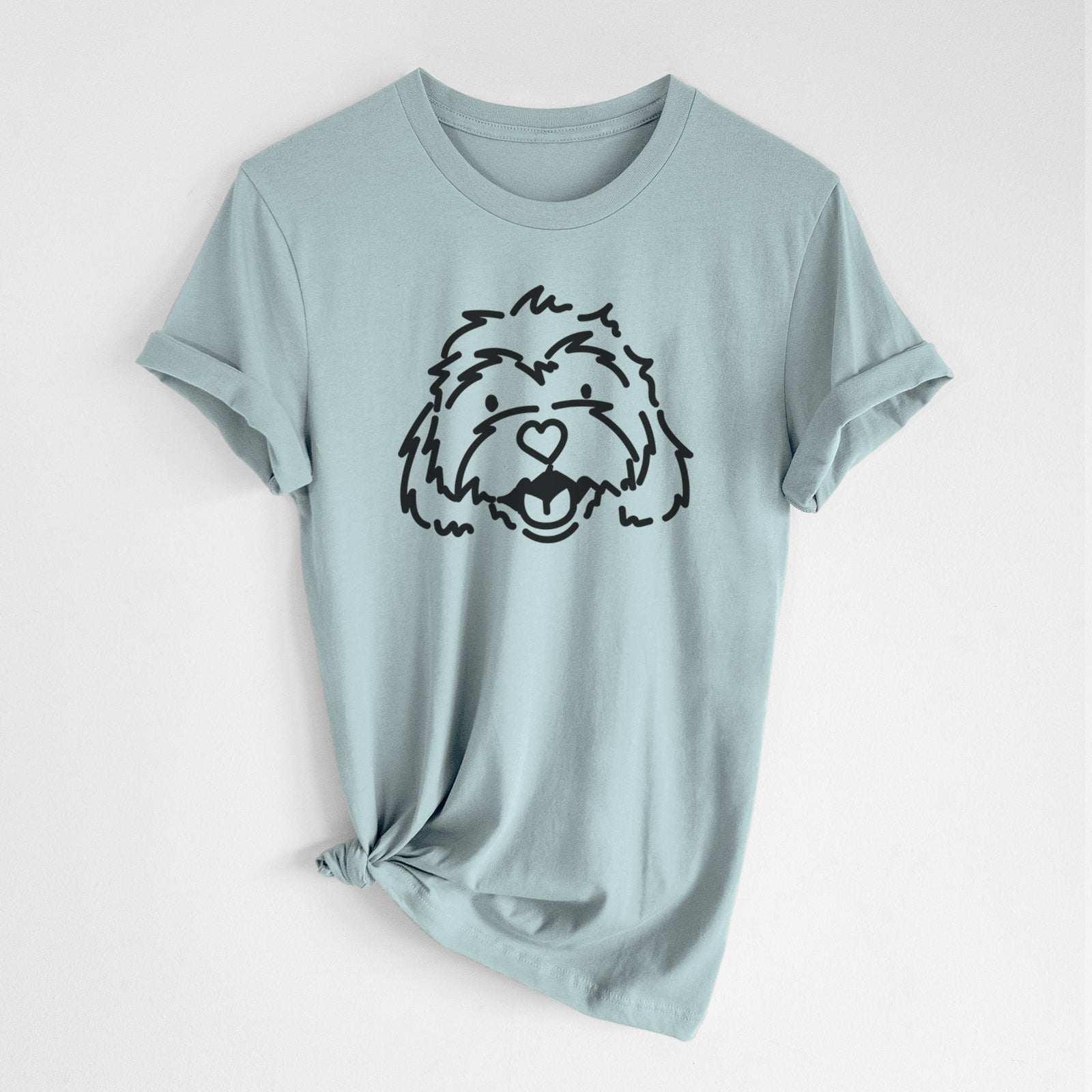Minimalist line drawing of Harry the Cavachon on a Dusty Blue Unisex crewneck, worn by a woman