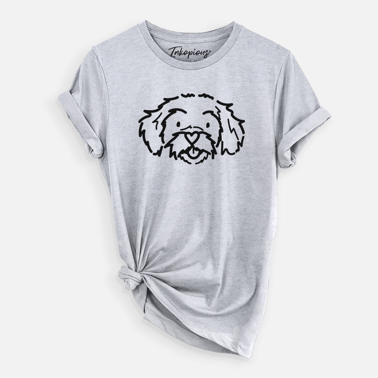 Minimalist line drawing of Jo Jo the Peekapoo on a Grey Unisex crewneck, worn by a woman