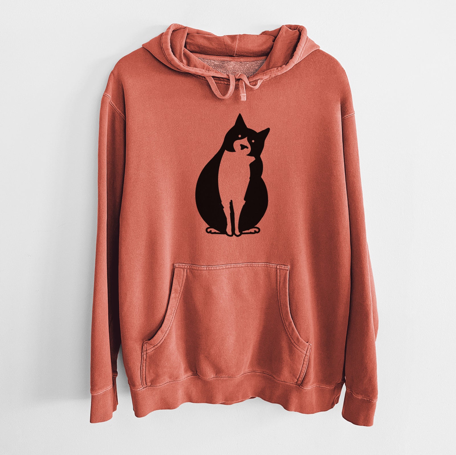 Minimalist line drawing of Oliver the Tuxedo Cat on an Amber Unisex pigment dyed hoodie