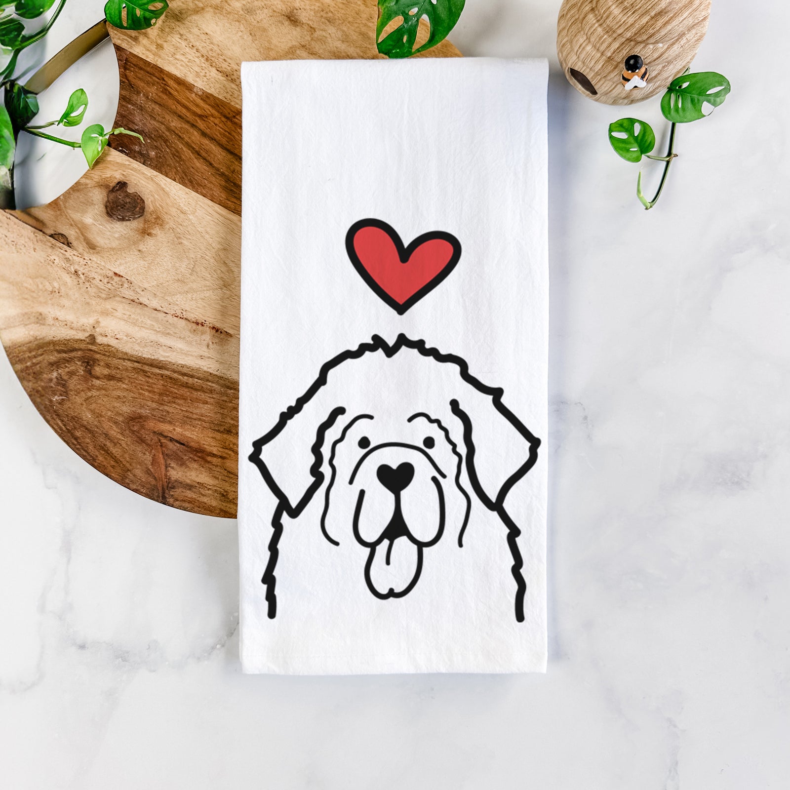 Minimalist line drawing of a Newfoundland with a red heart on a tea towel