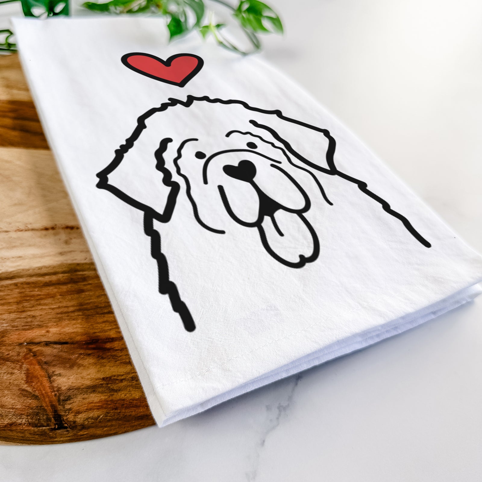 Minimalist line drawing of a Newfoundland with a red heart on a tea towel