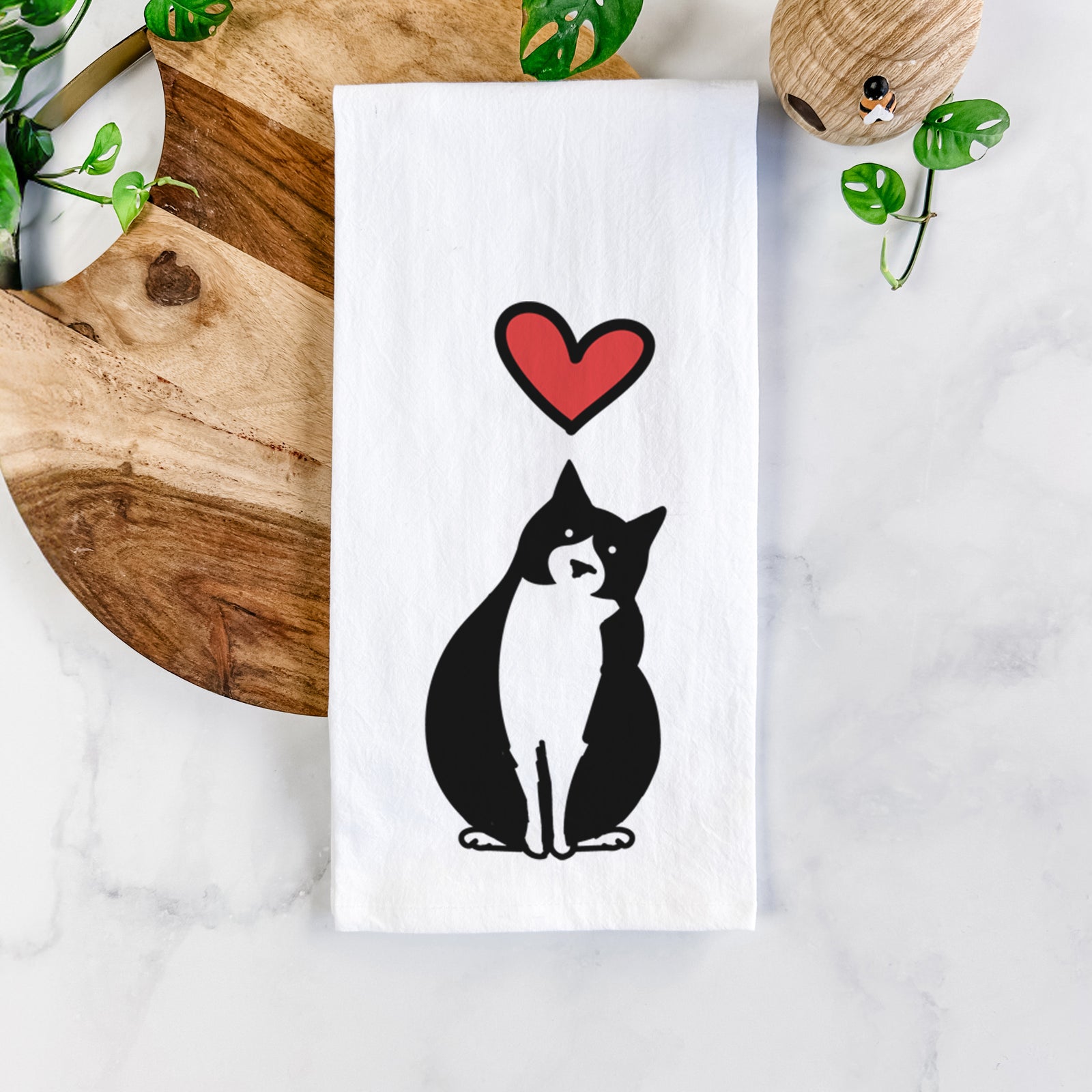 Minimalist line drawing of Oliver the Tuxedo Cat with a red heart on a tea towel
