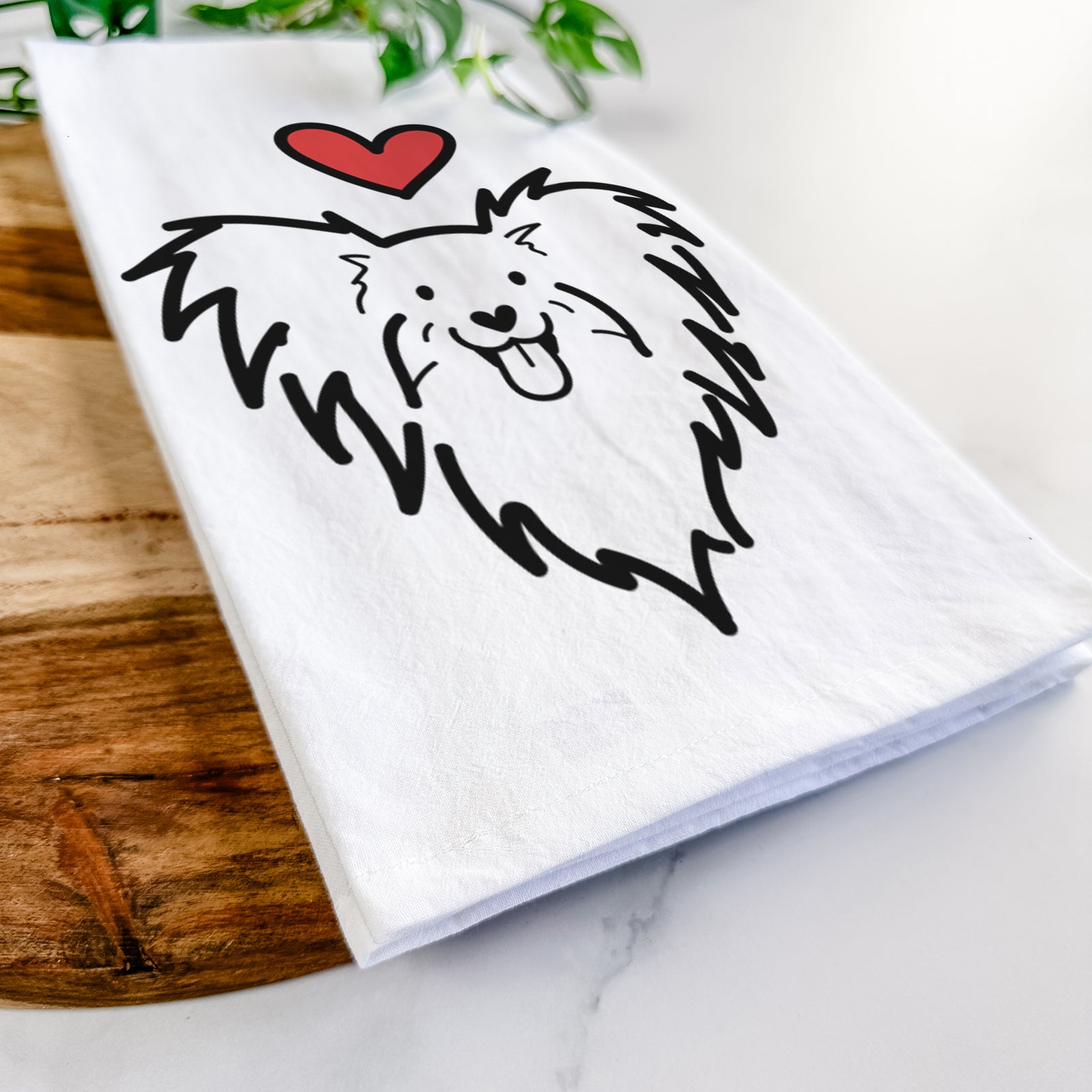 Minimalist line drawing of a Papillon with a red heart on a tea towel
