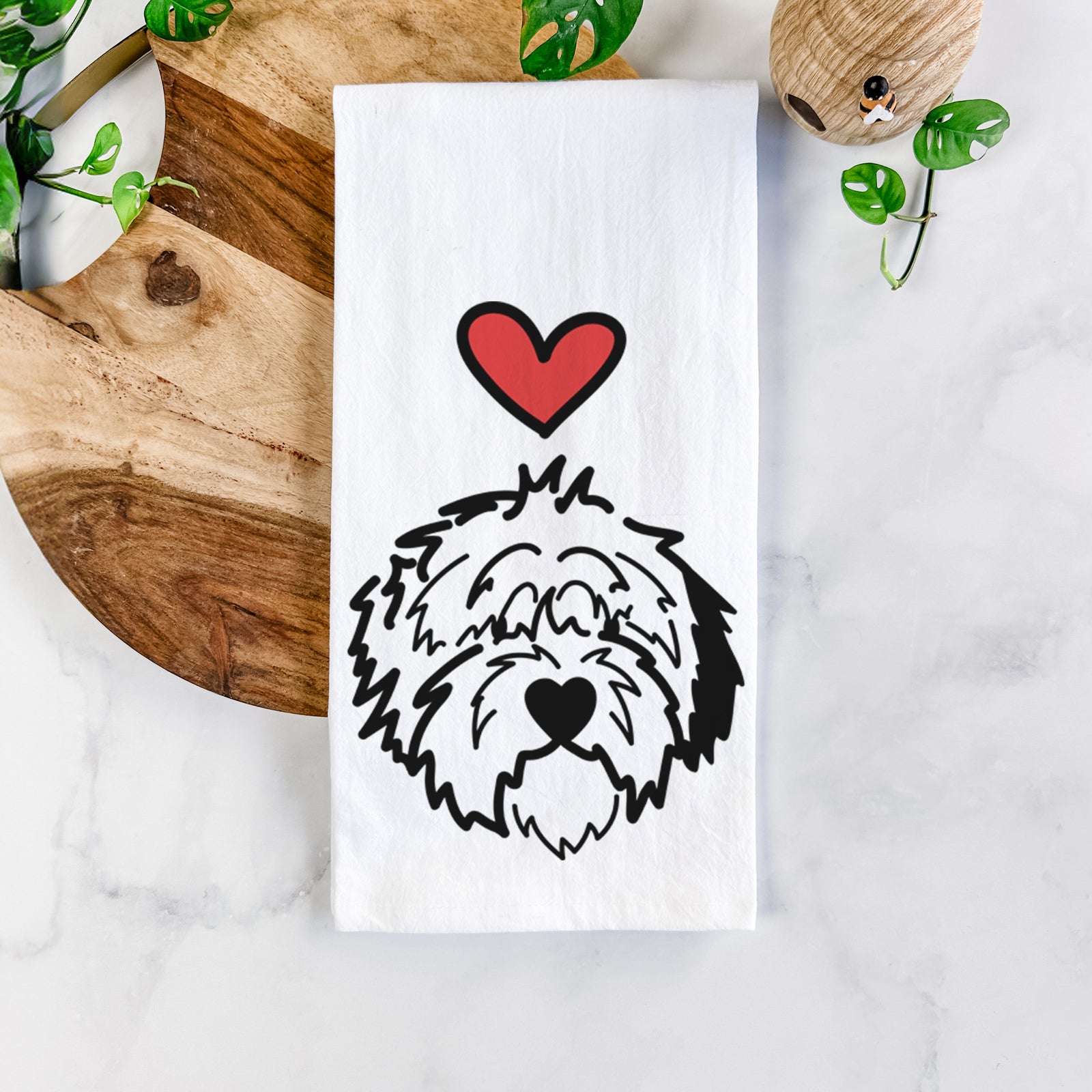 Minimalist line drawing of Penny the Old English Sheepdog with a red heart on a tea towel