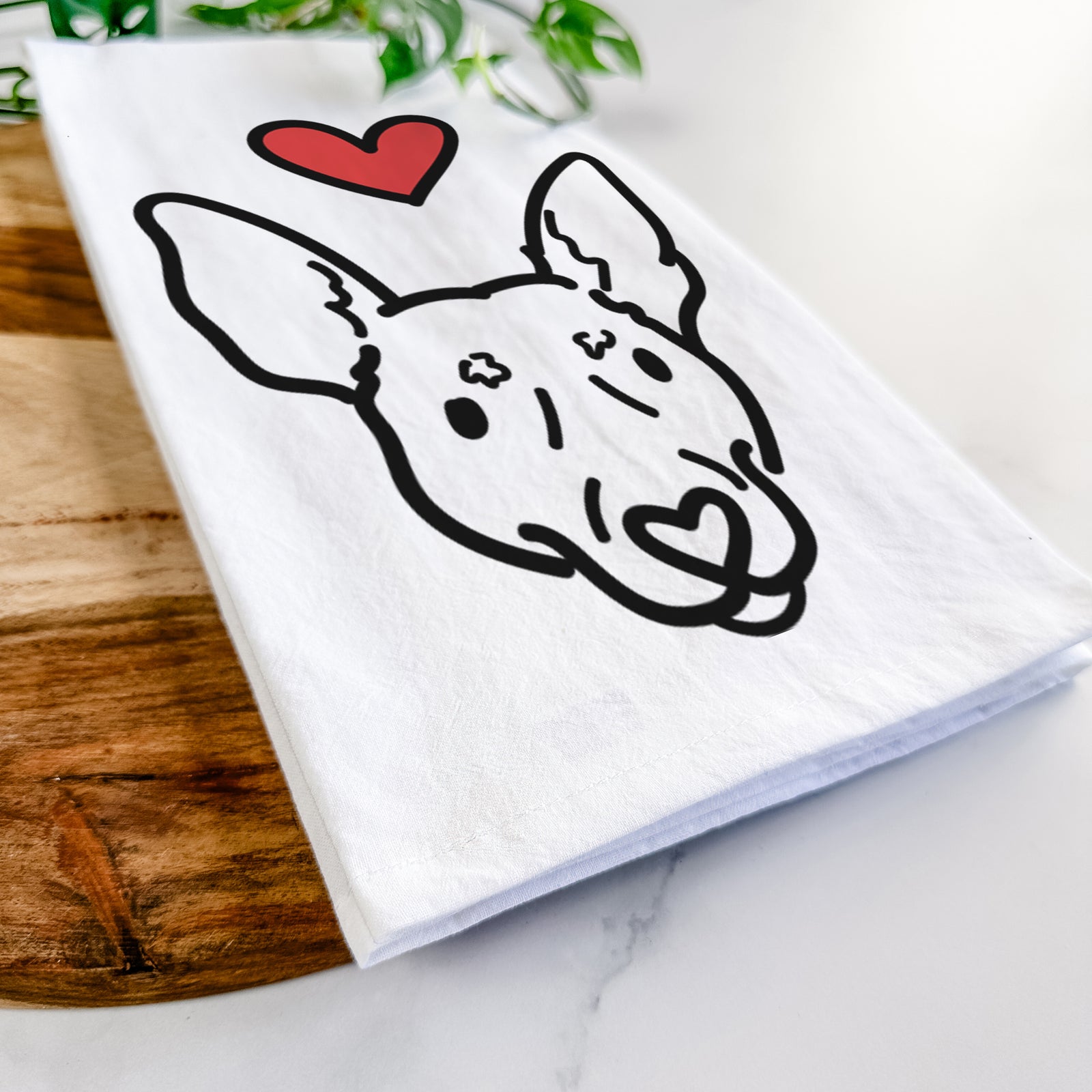 Minimalist line drawing of Penny the Rat Terrier with a red heart on a tea towel