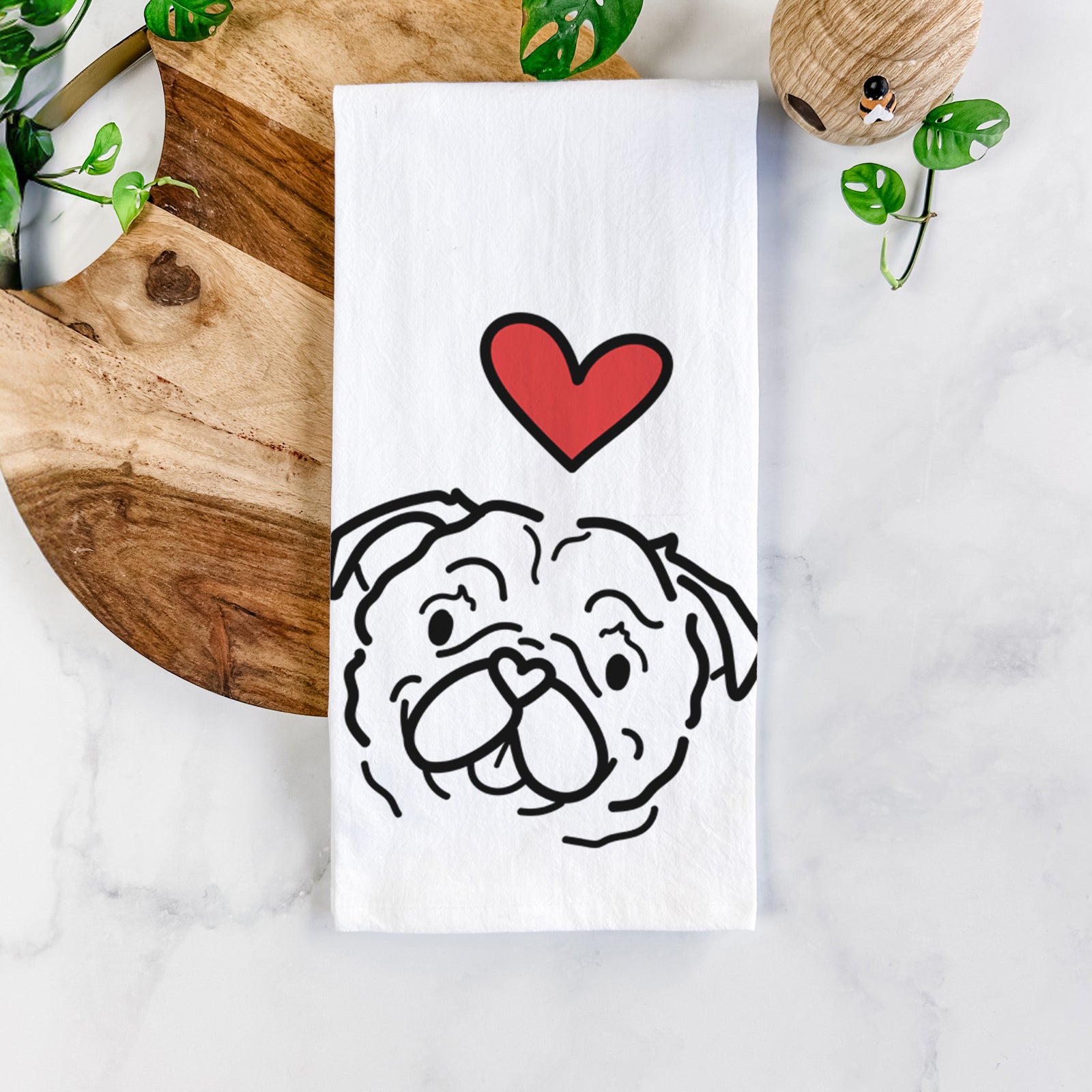 Minimalist line drawing of Pip the Pug with a red heart on a tea towel
