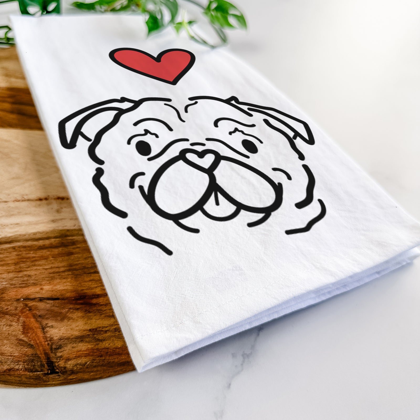 Minimalist line drawing of Pip the Pug with a red heart on a tea towel