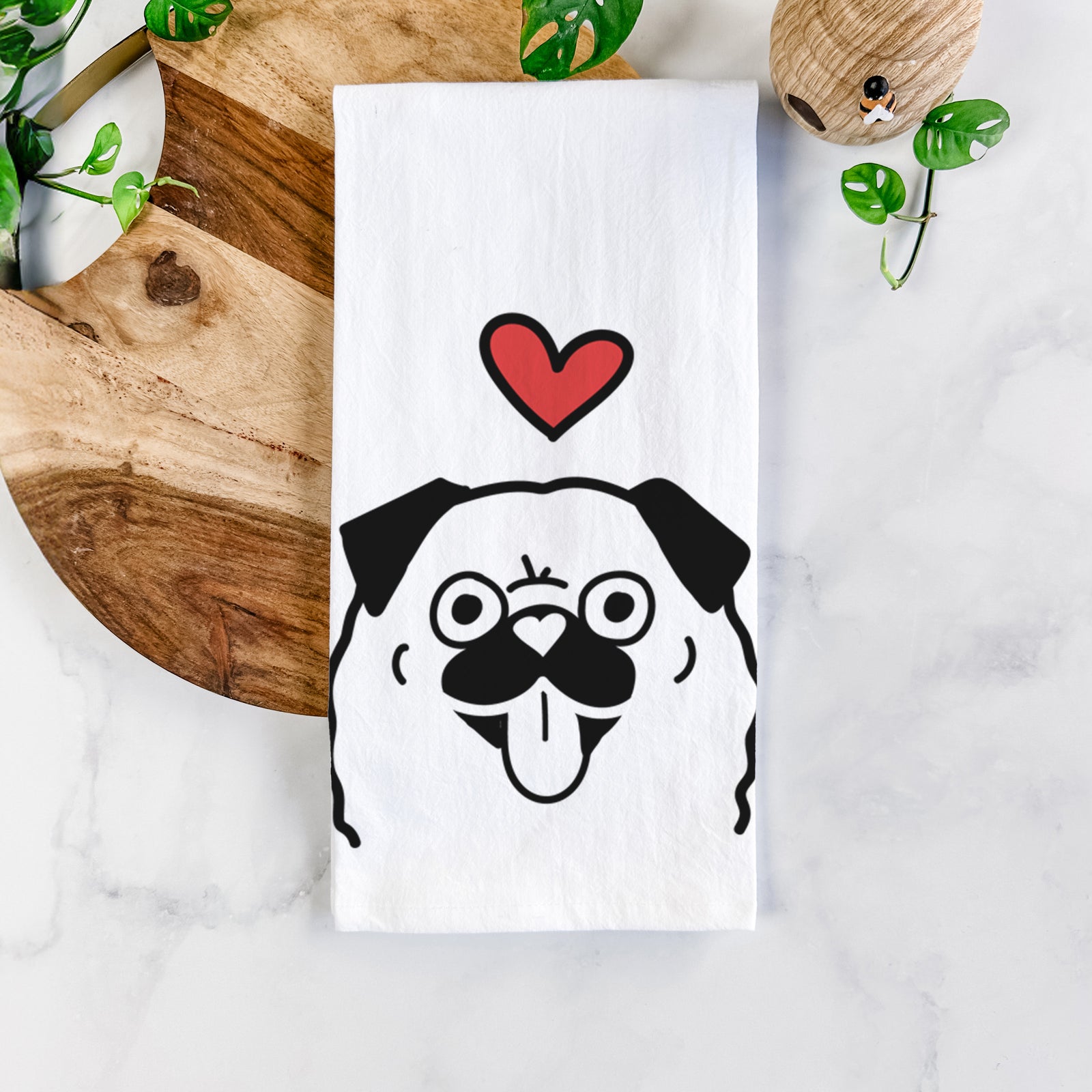 Minimalist line drawing of a Pug with a red heart on a tea towel