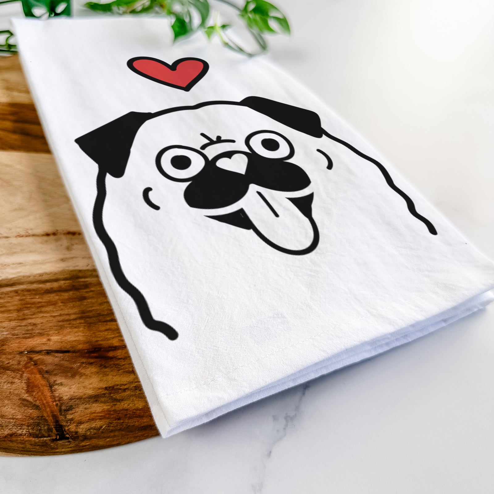 Minimalist line drawing of a Pug with a red heart on a tea towel