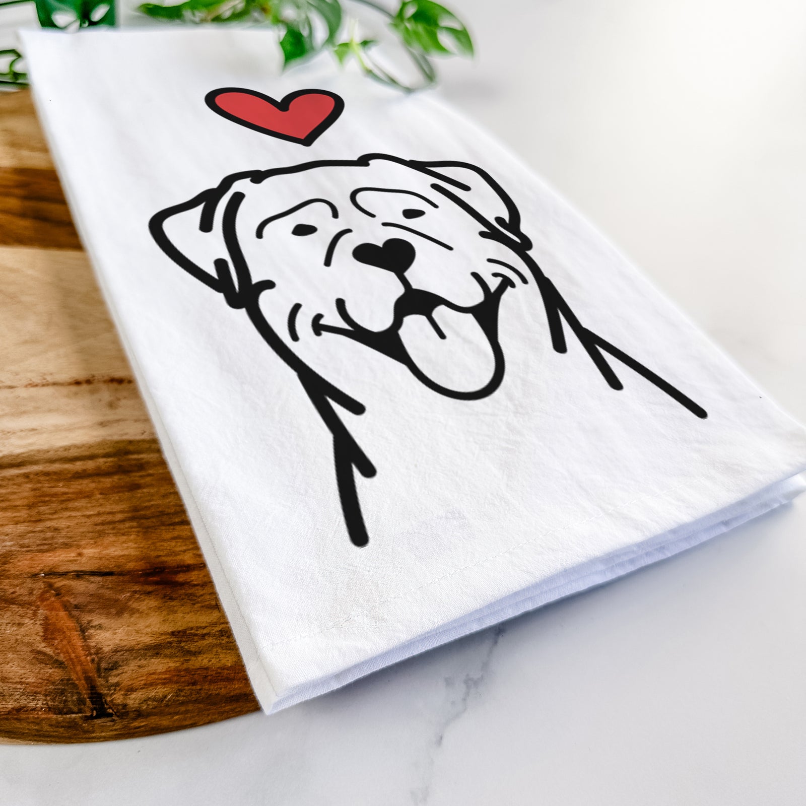 Minimalist line drawing of a Rottweiler with a red heart on a tea towel