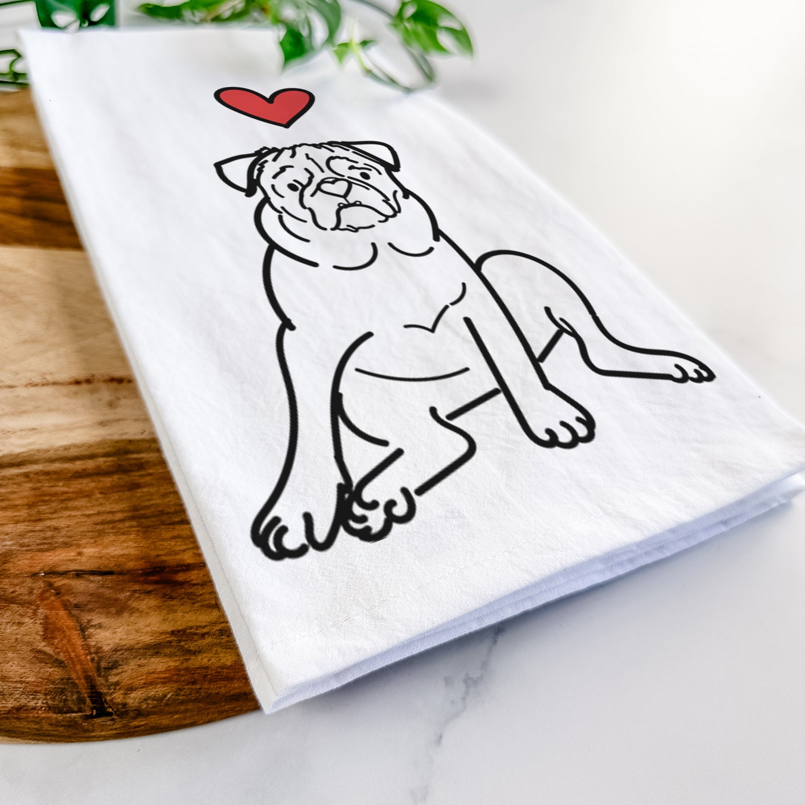 Minimalist line drawing of Rudy the Pug with a red heart on a tea towel