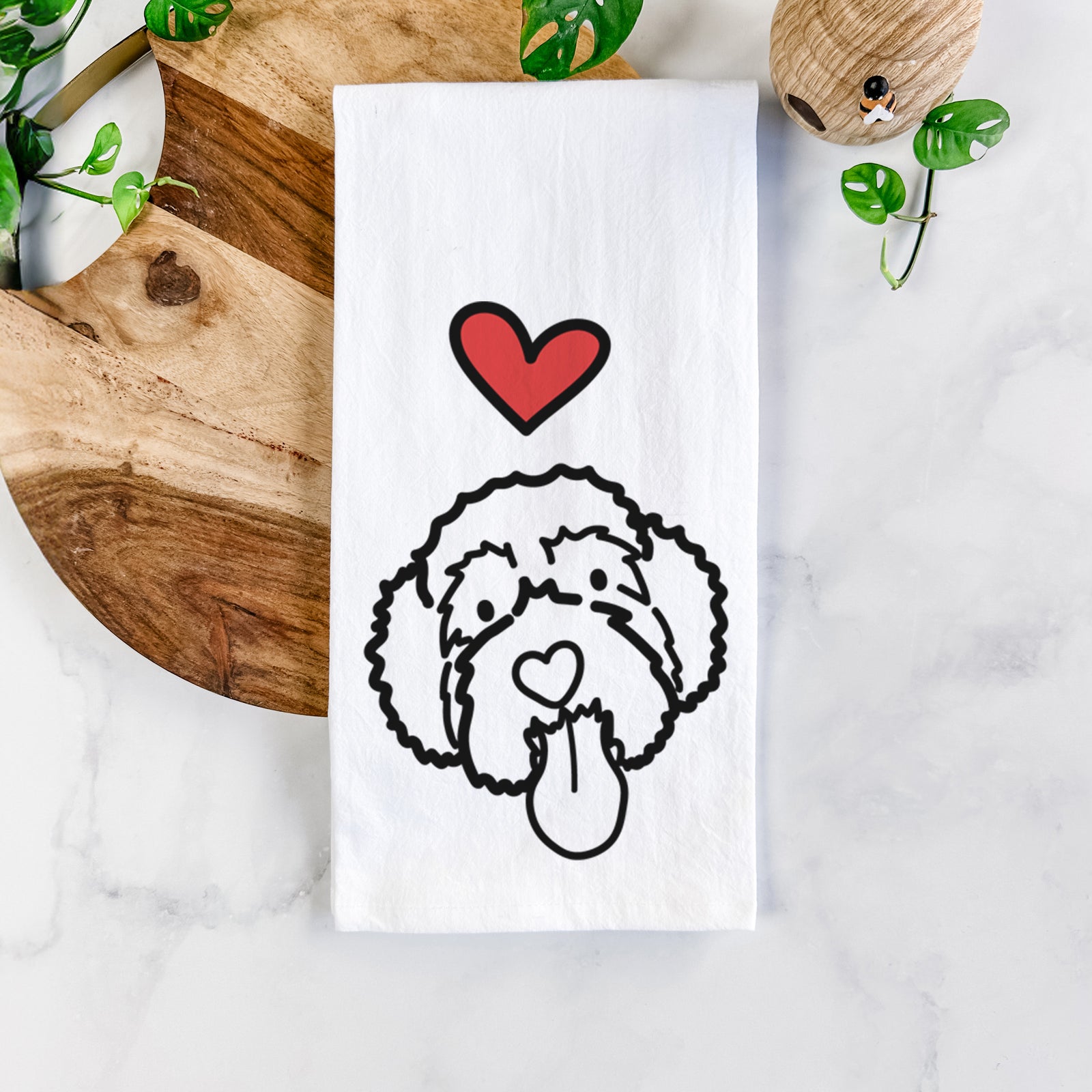 Minimalist line drawing of Sam the Portguese Water Dog with a red heart on a tea towel