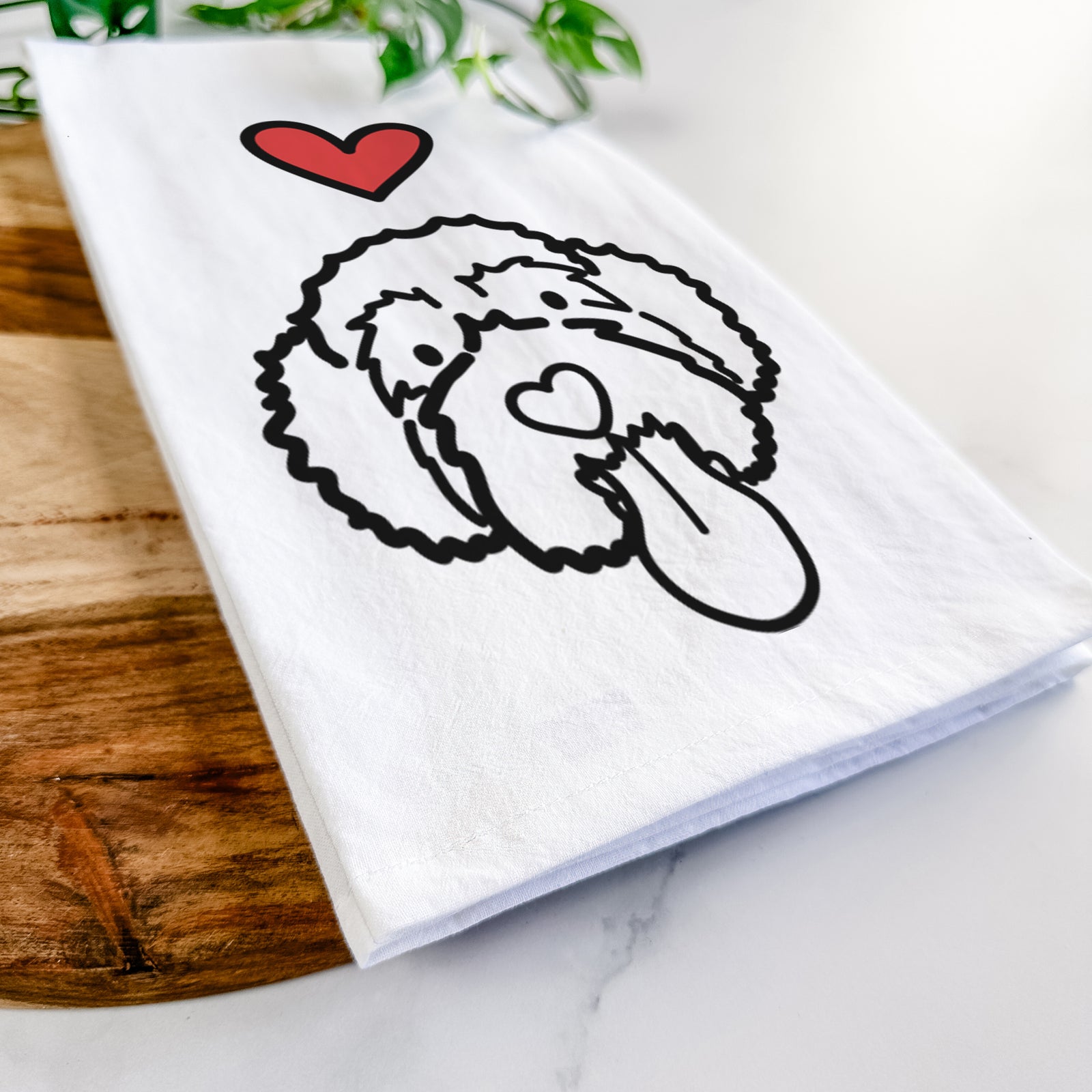 Minimalist line drawing of Sam the Portguese Water Dog with a red heart on a tea towel