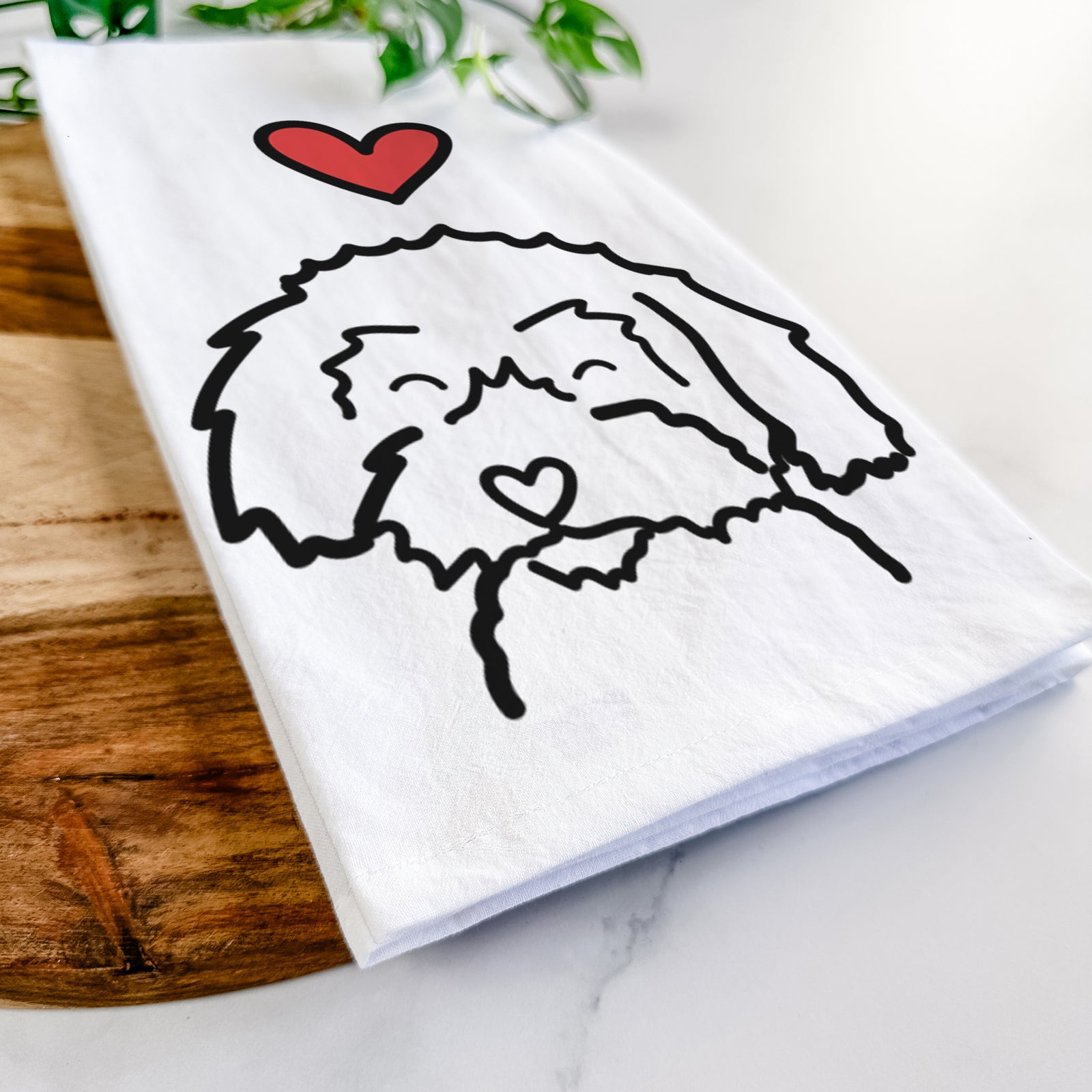 Minimalist line drawing of a Schnoodle with a red heart on a tea towel