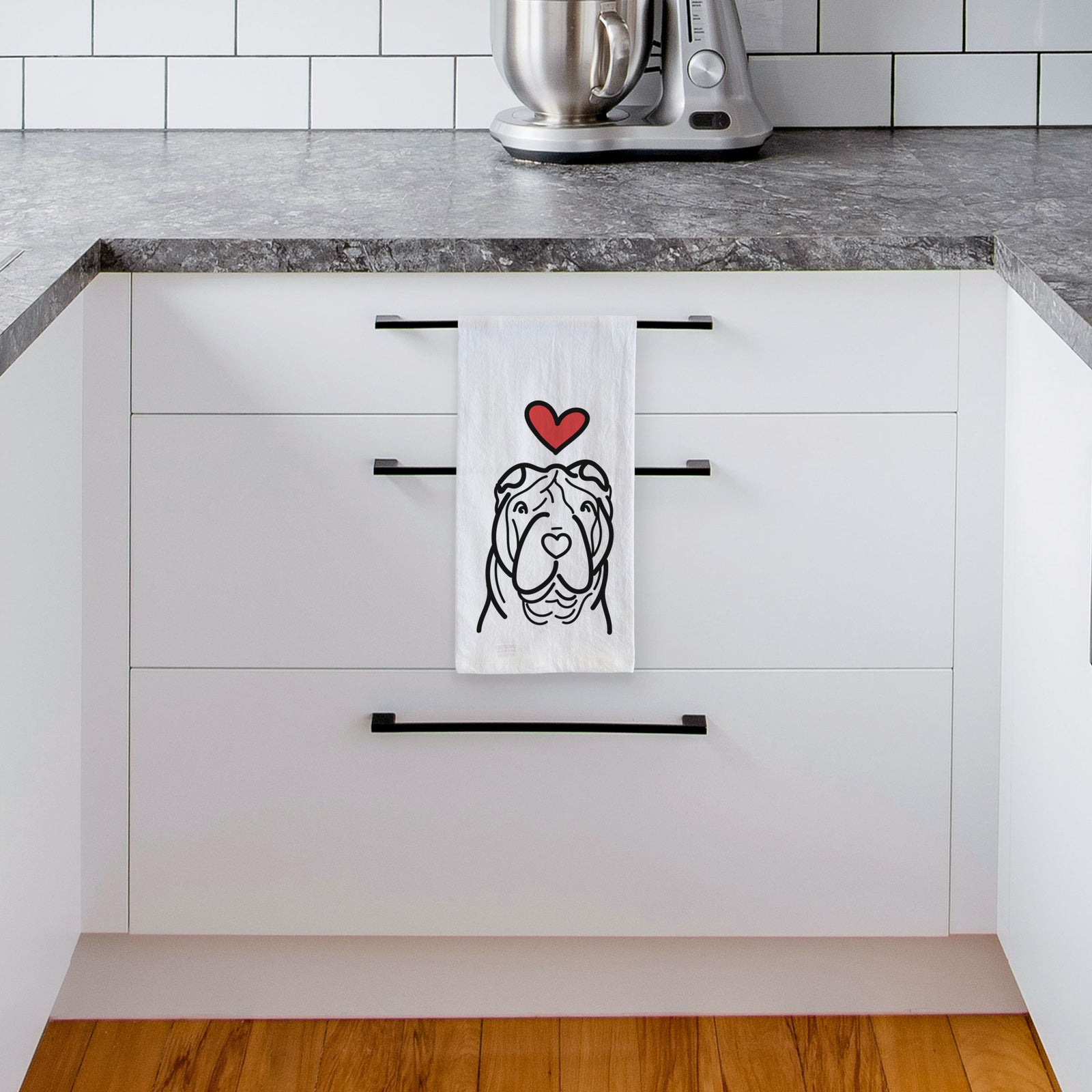 Minimalist line drawing of a Shar Pei with a red heart on a tea towel, hanging on an oven door in a kitchen