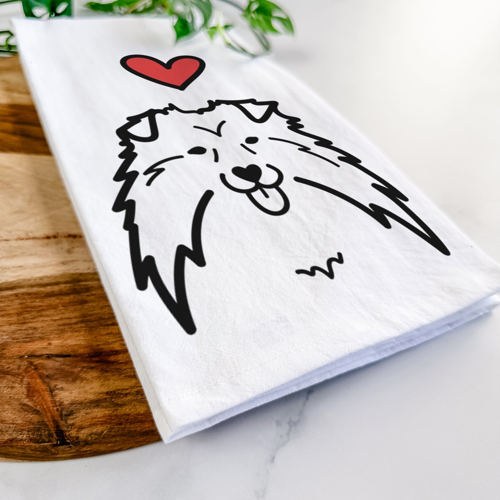 Minimalist line drawing of a Shetland Sheepdog with a red heart on a tea towel