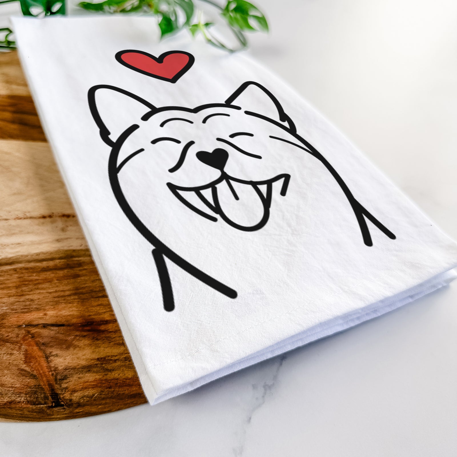 Minimalist line drawing of a Shiba Inu with a red heart on a tea towel