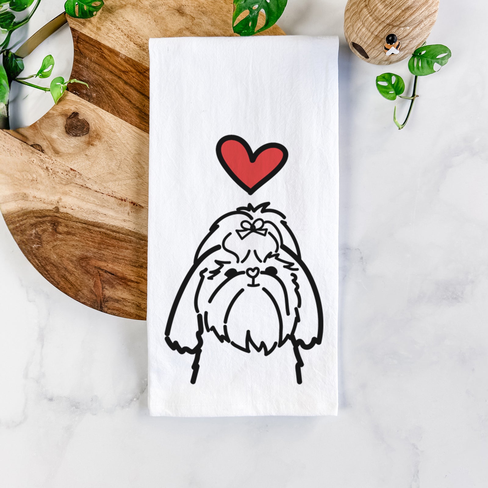 Minimalist line drawing of a Shih Tzu with a red heart on a tea towel