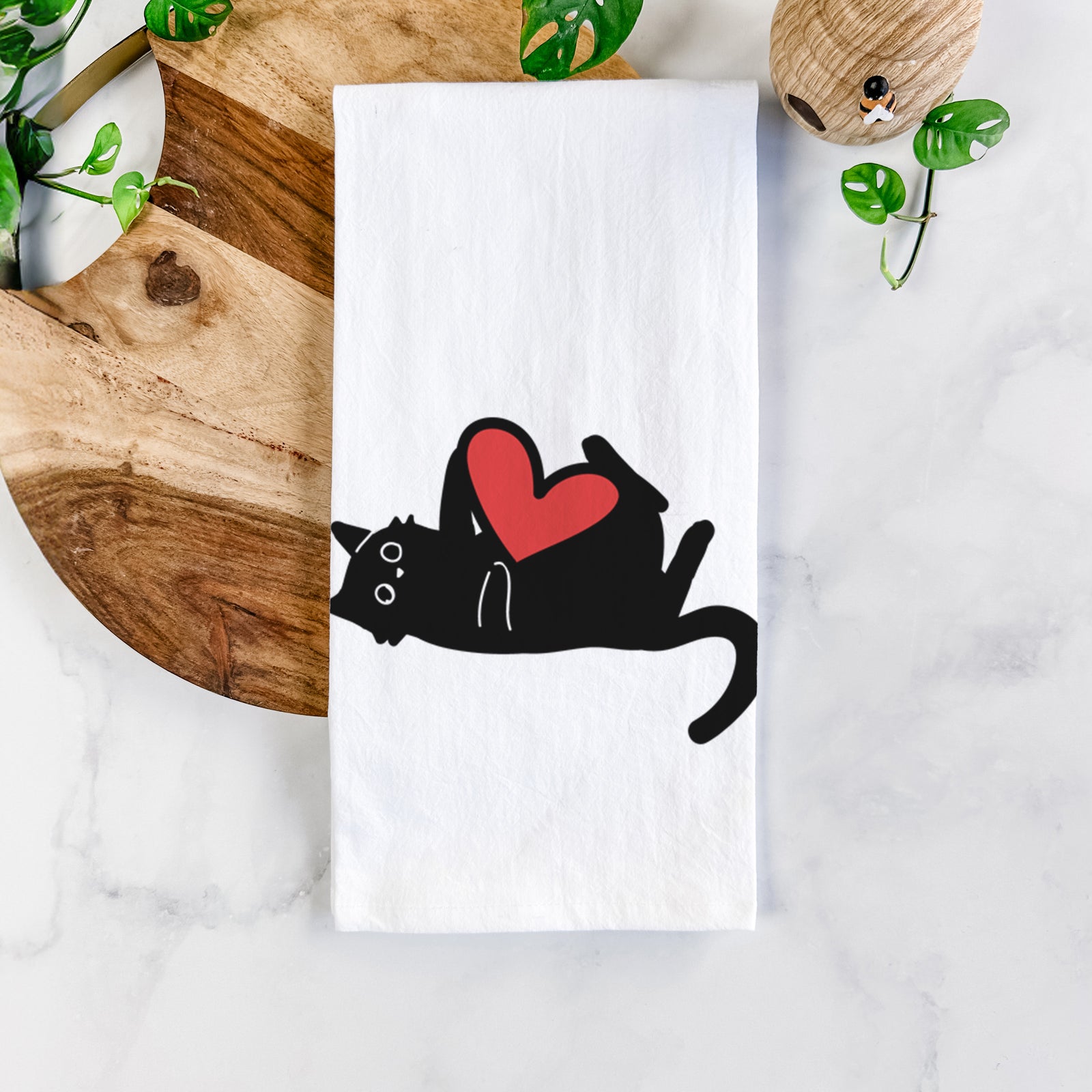 Minimalist line drawing of Smash the Black Cat with a red heart on a tea towel
