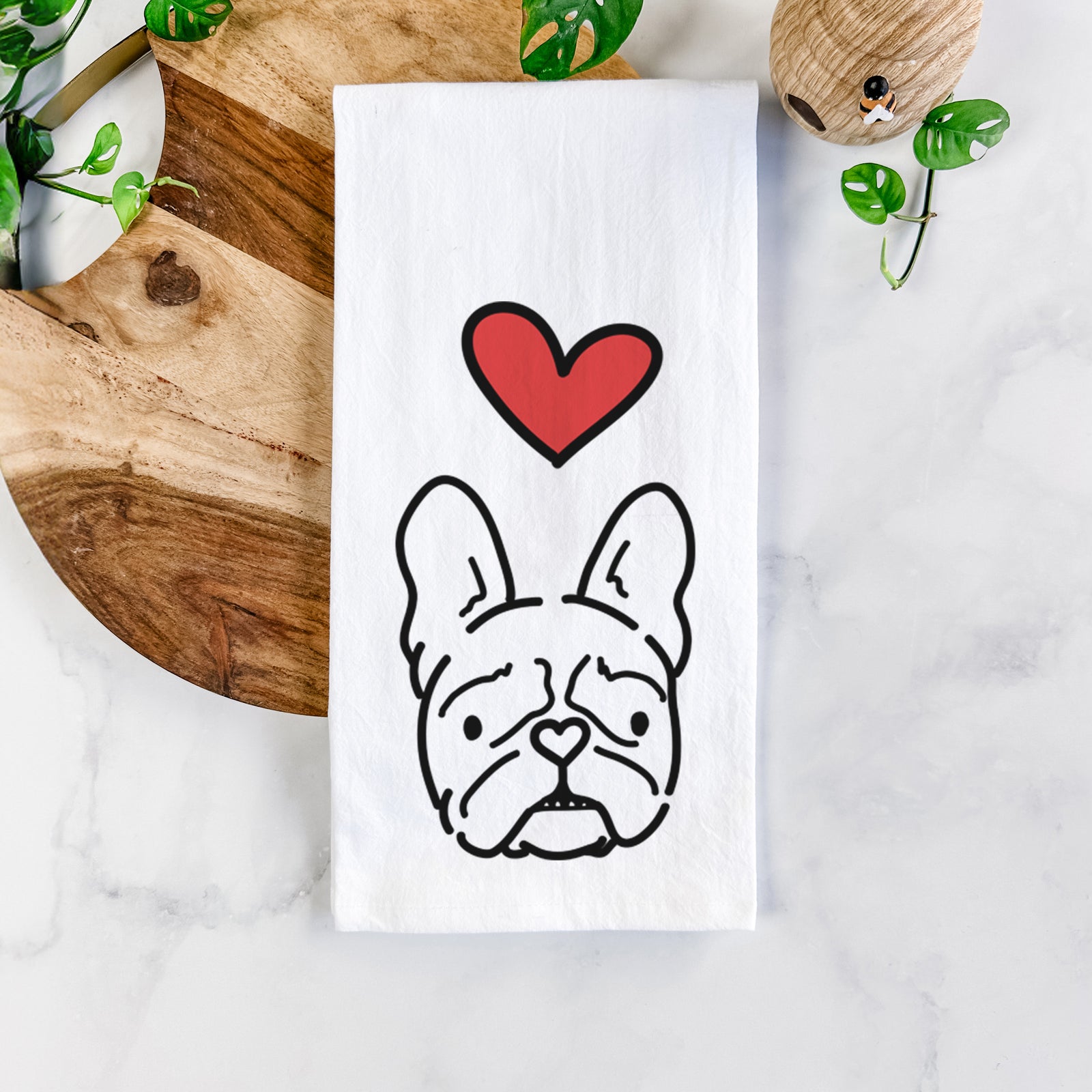 Minimalist line drawing of Squishy the French Bulldog with a red heart on a tea towel