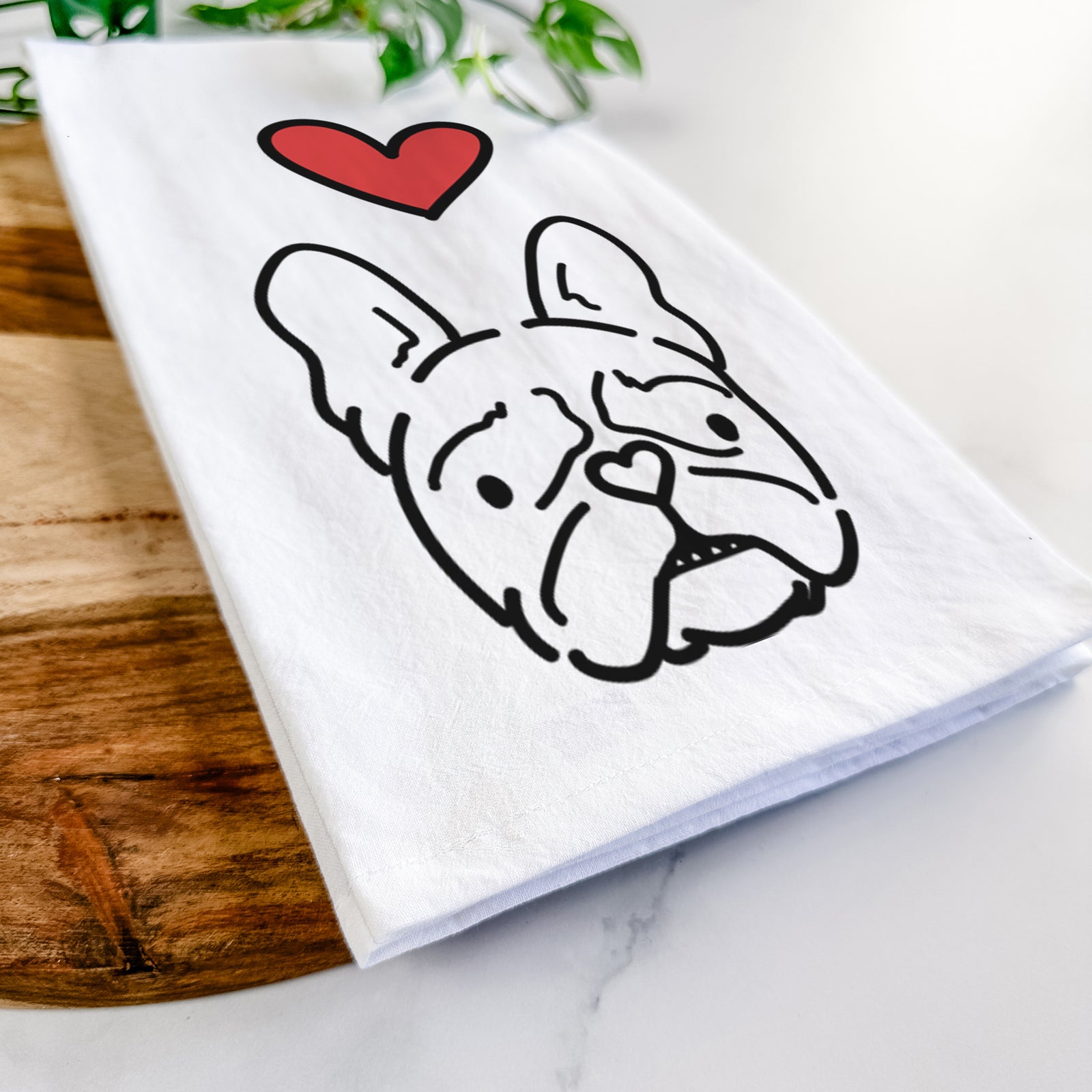 Minimalist line drawing of Squishy the French Bulldog with a red heart on a tea towel
