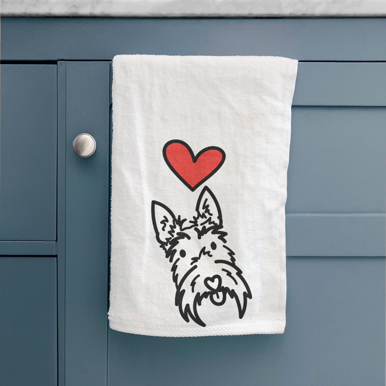 Minimalist line drawing of Thistle the Scottish Terrier with a red heart on a decorative hand towel
