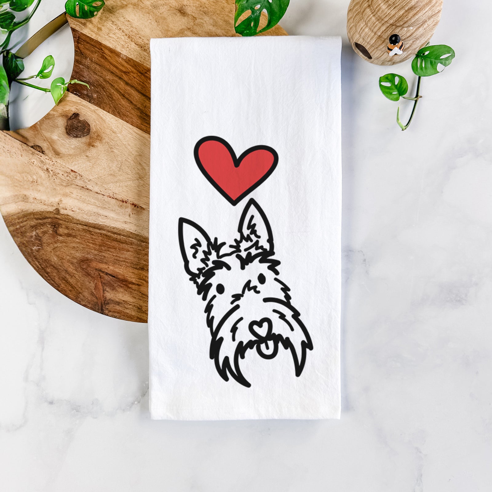 Minimalist line drawing of Thistle the Scottish Terrier with a red heart on a tea towel