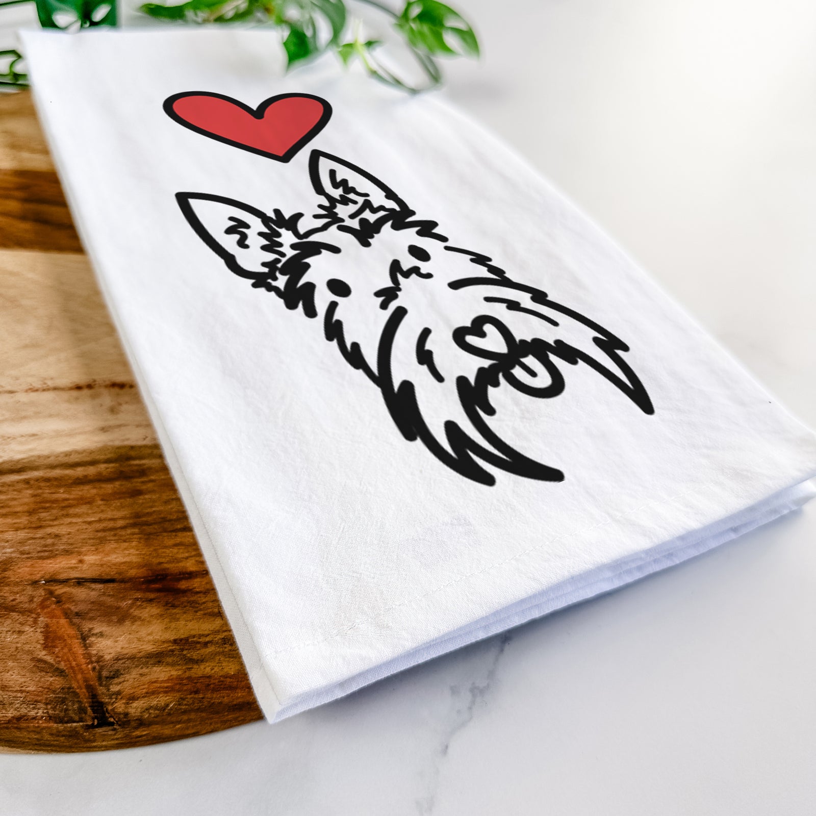 Minimalist line drawing of Thistle the Scottish Terrier with a red heart on a tea towel