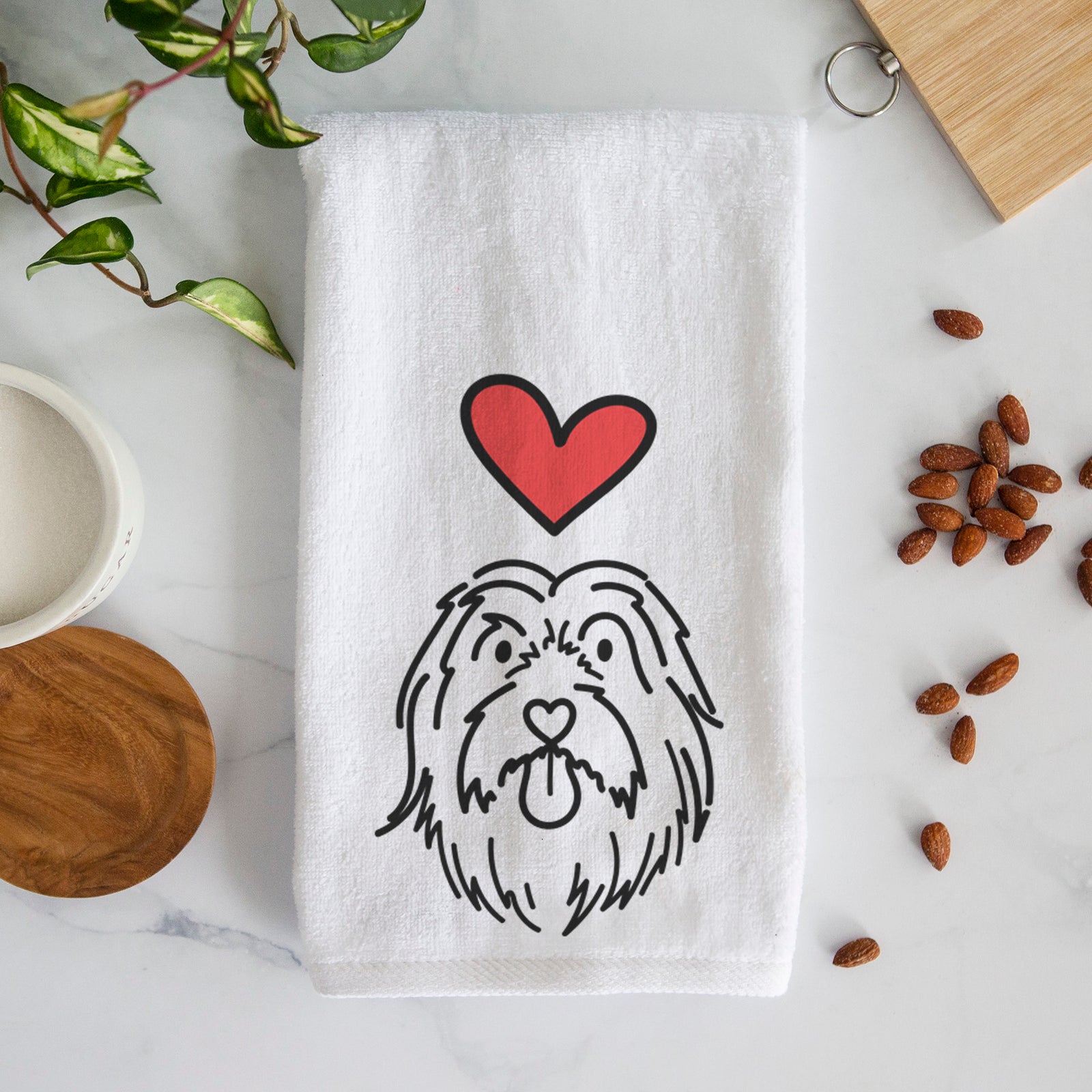 Minimalist line drawing of Tucker the Bearded Collie with a red heart on a decorative hand towel
