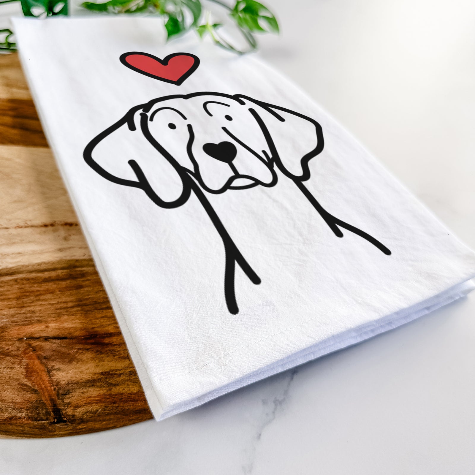 Minimalist line drawing of a Weimaraner with a red heart on a tea towel