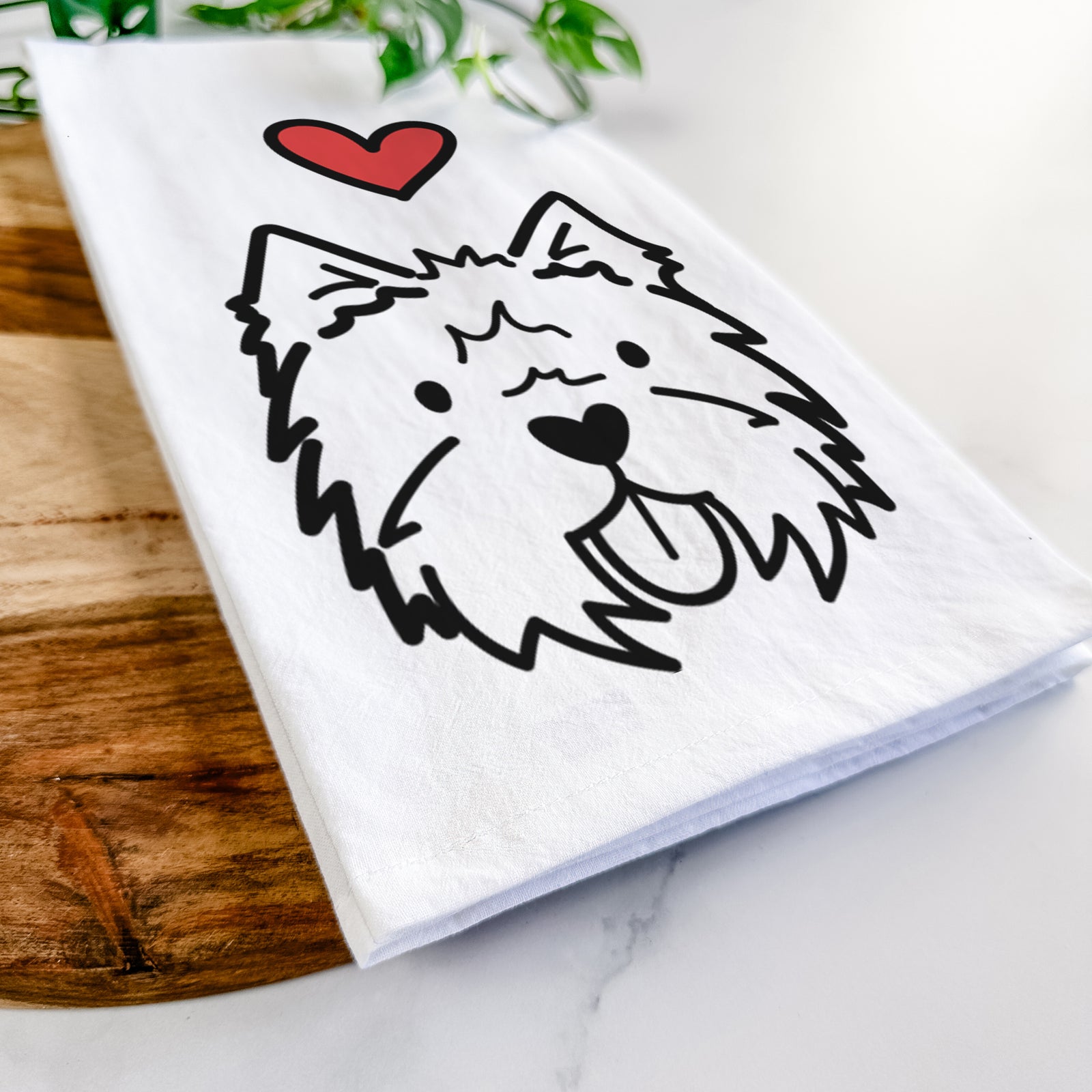 Minimalist line drawing of a West Highland Terrier with a red heart on a tea towel