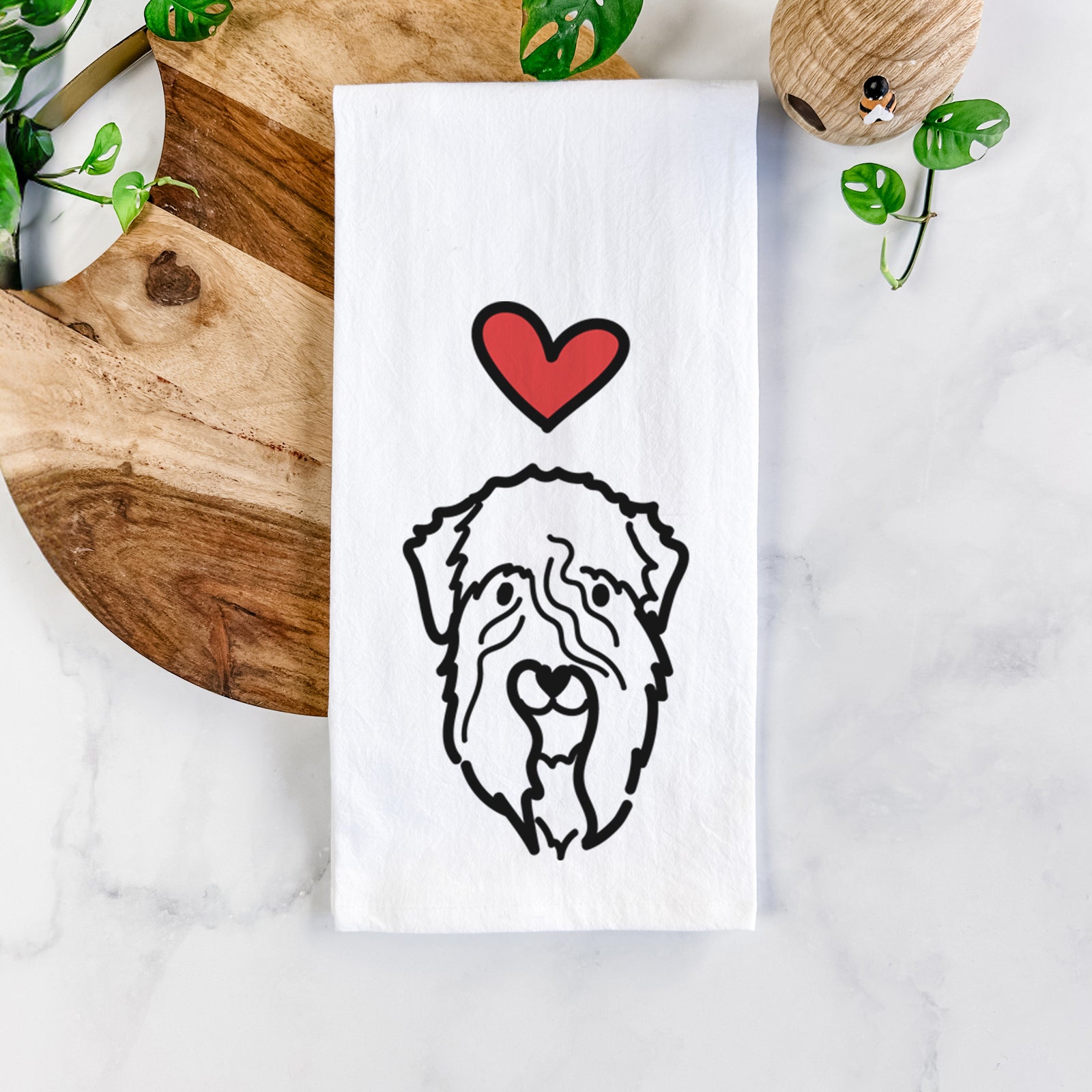 Minimalist line drawing of a Soft Coated Wheaten Terrier with a red heart on a tea towel