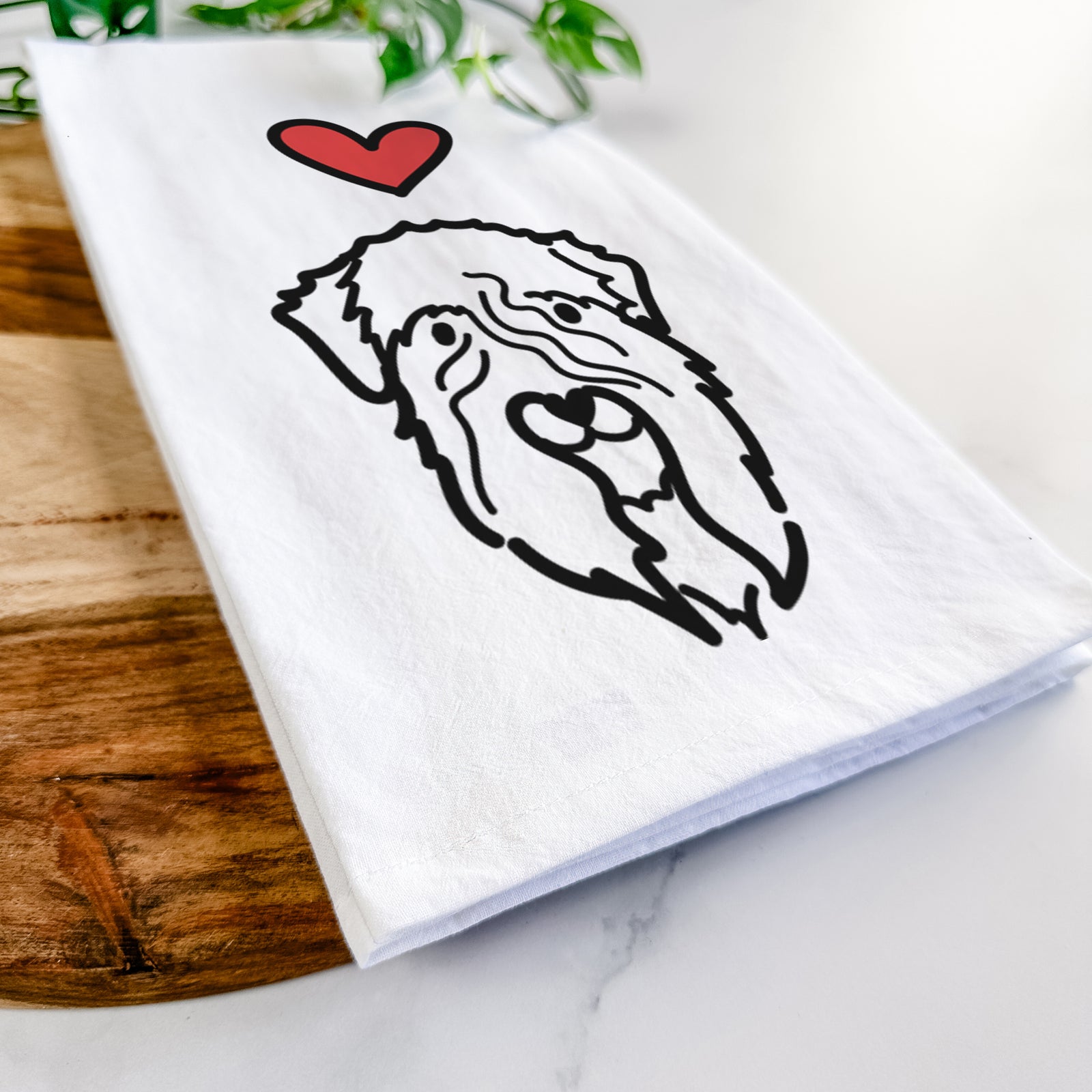 Minimalist line drawing of a Soft Coated Wheaten Terrier with a red heart on a tea towel