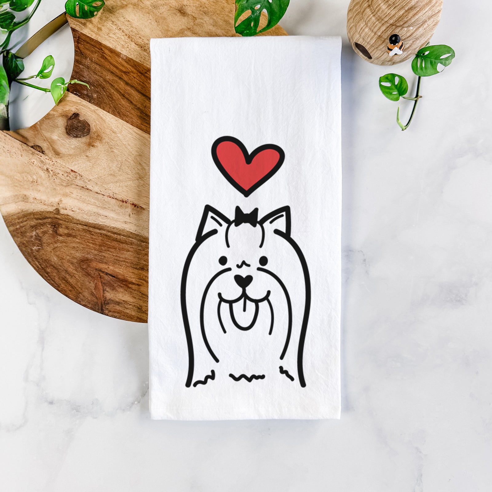 Minimalist line drawing of a Yorkshire Terrier with a red heart on a tea towel