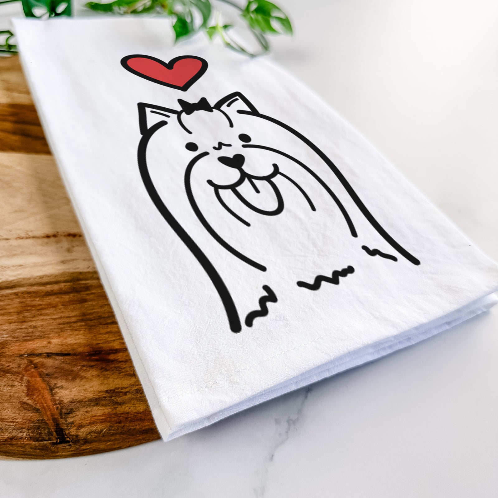 Minimalist line drawing of a Yorkshire Terrier with a red heart on a tea towel