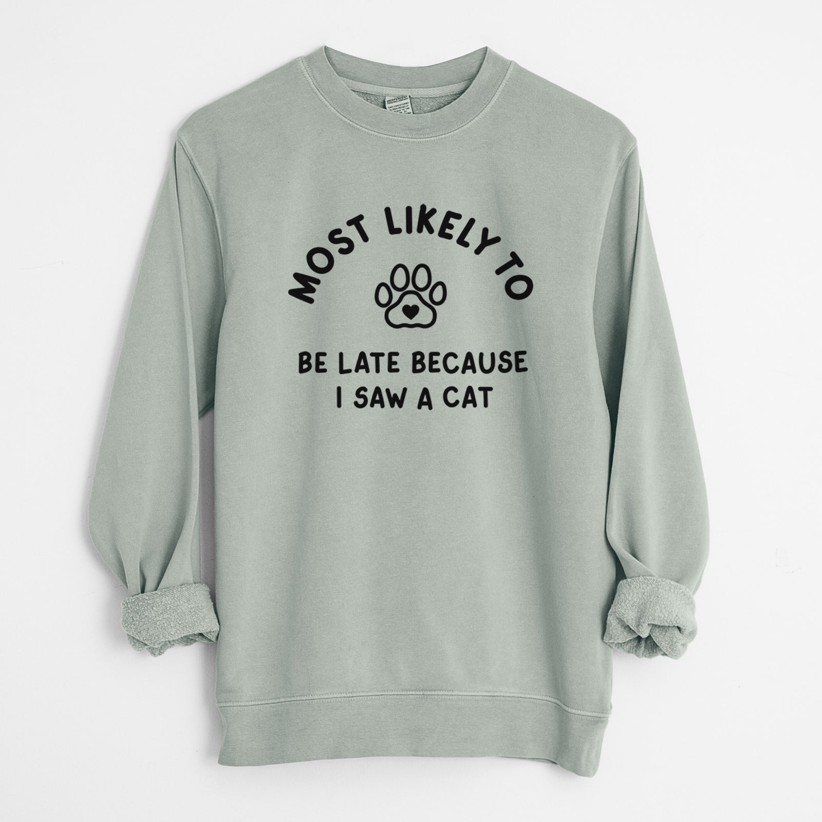 'Most Likely to Be Late Because I Saw a Cat' design on a Sage Unisex pigment dyed crew sweatshirt